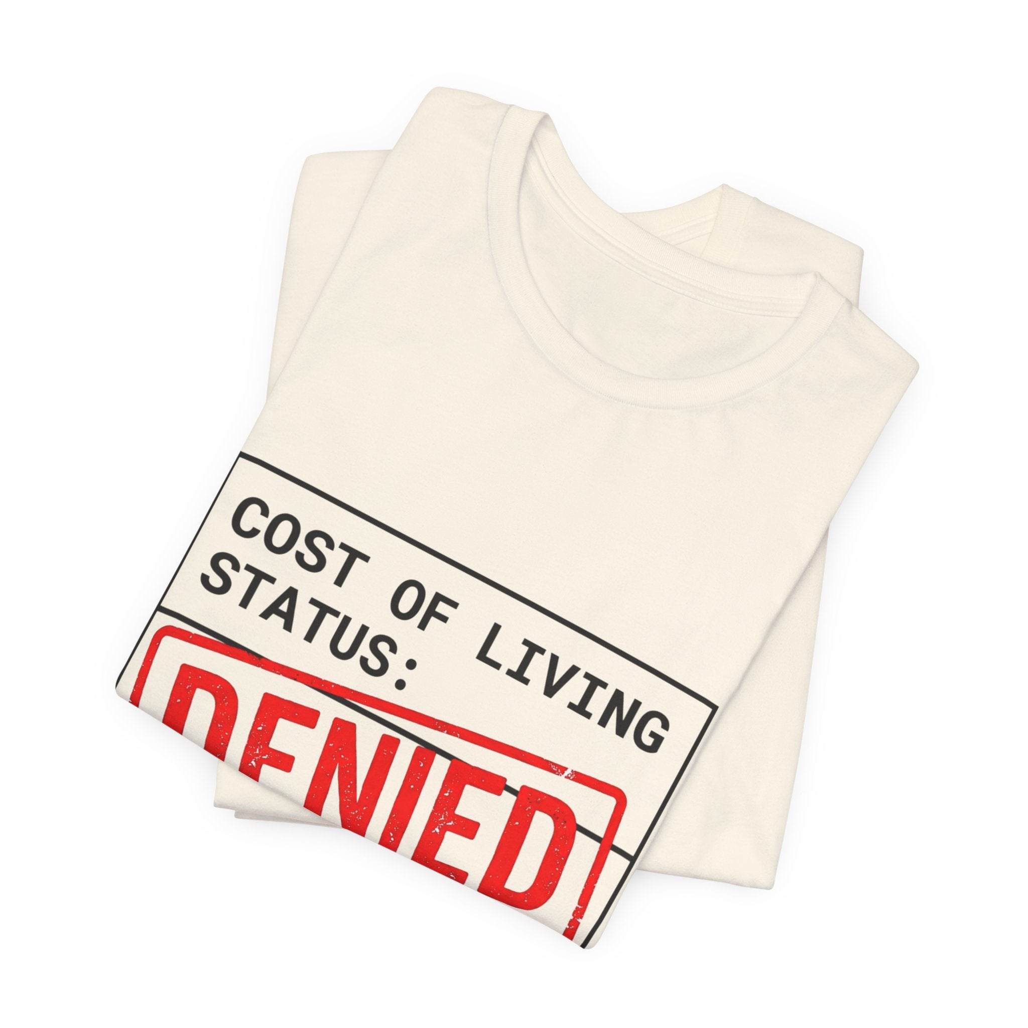 Tristan’s Treehouse Cost of Living Status: DENIED Tee | cost of living crisis, budget humor — flat-lay composition