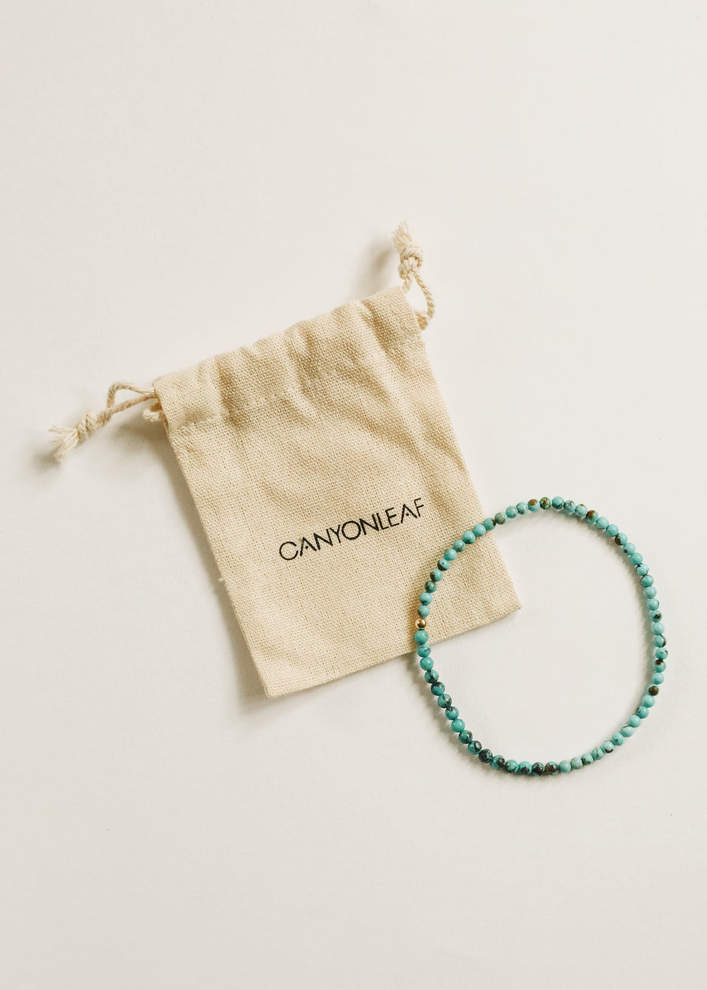CanyonLeaf Natural Turquoise + 14K Gold Filled || Beaded Stretch Bracelet — CanyonLeaf branding close-up