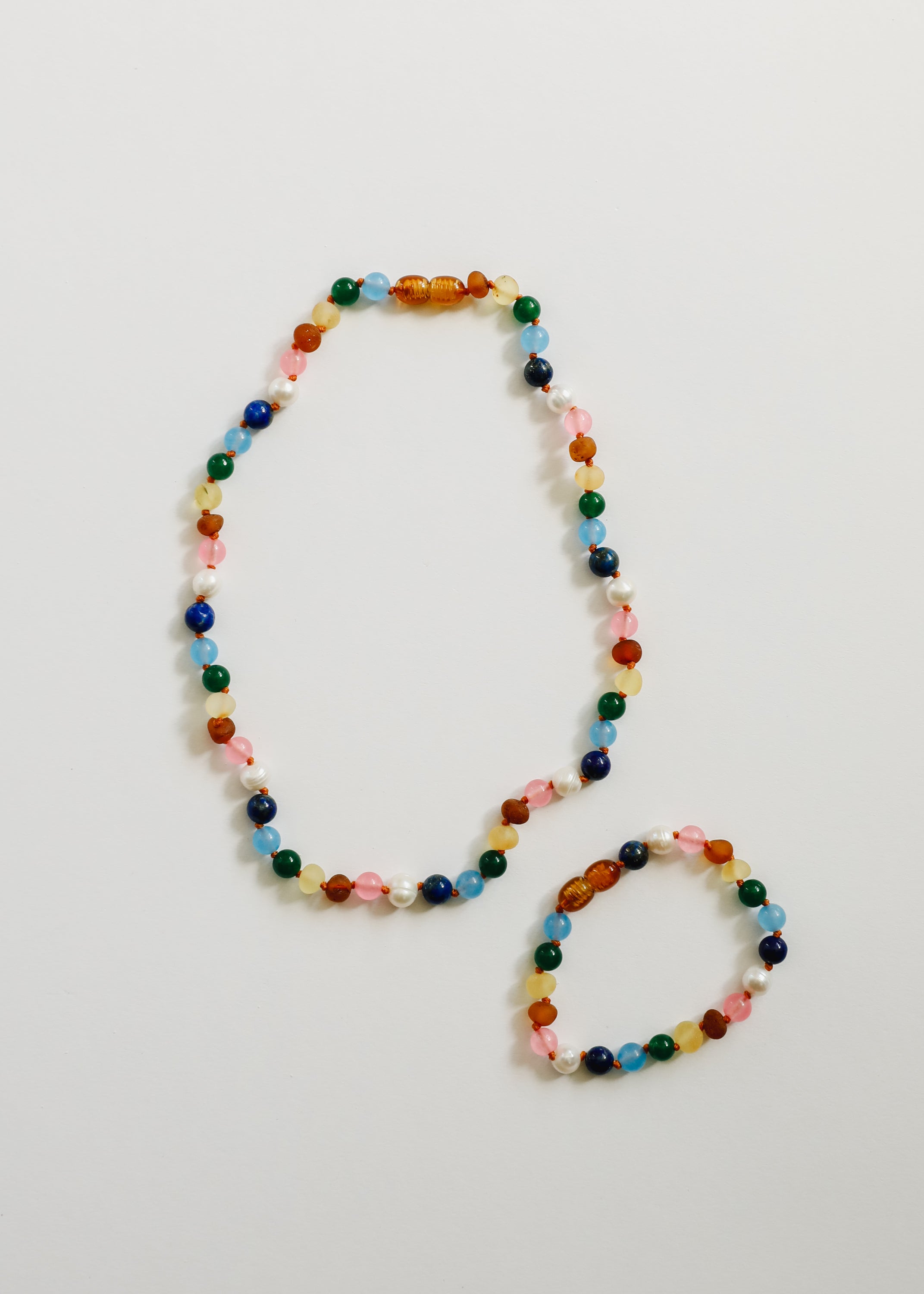 CanyonLeaf Raw Baltic Amber and Pearl Necklace + Sweet Pink Gemstones — CanyonLeaf branding close-up