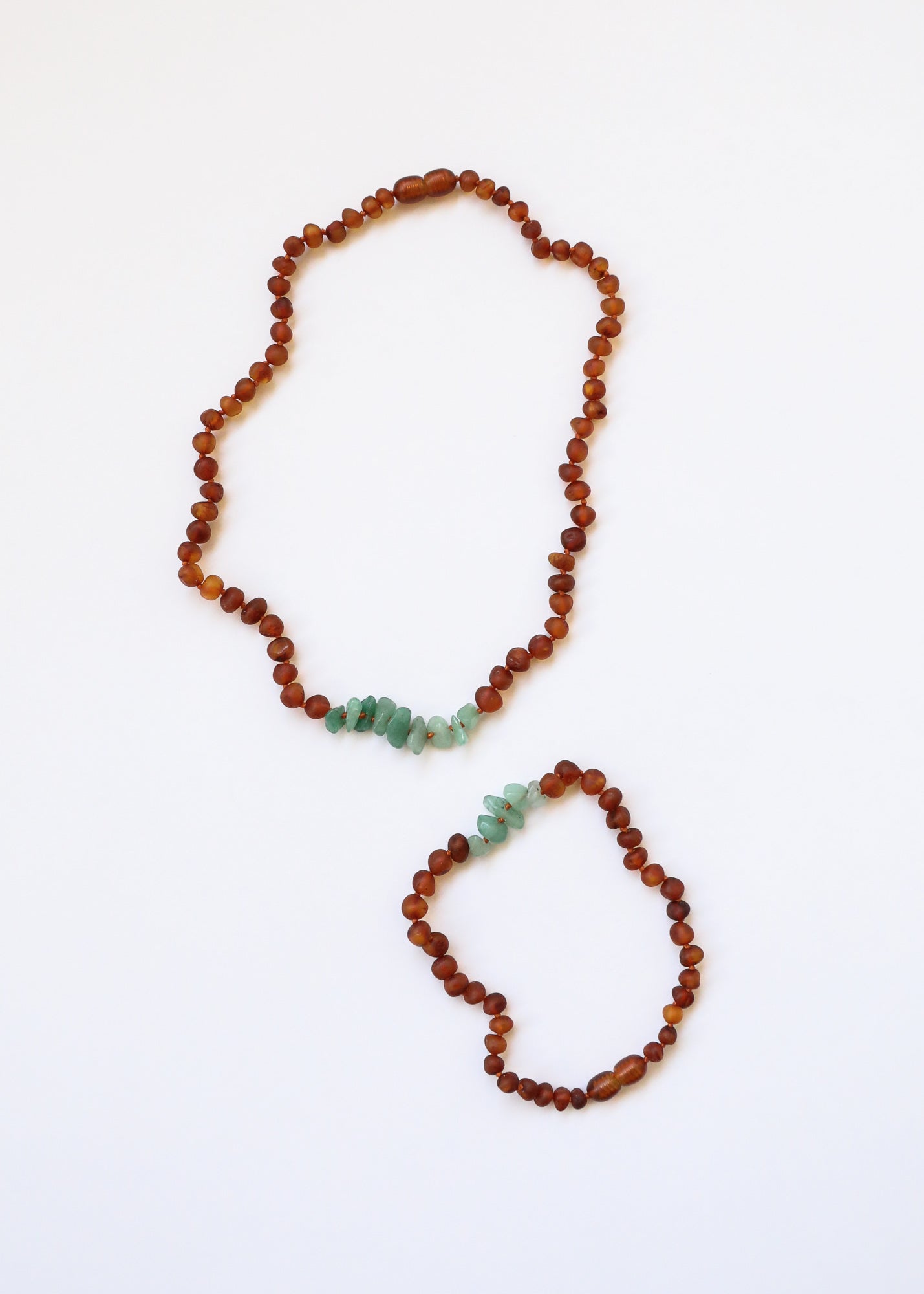 CanyonLeaf Raw Cognac Baltic Amber + Raw Aventurine || Necklace — CanyonLeaf branding close-up