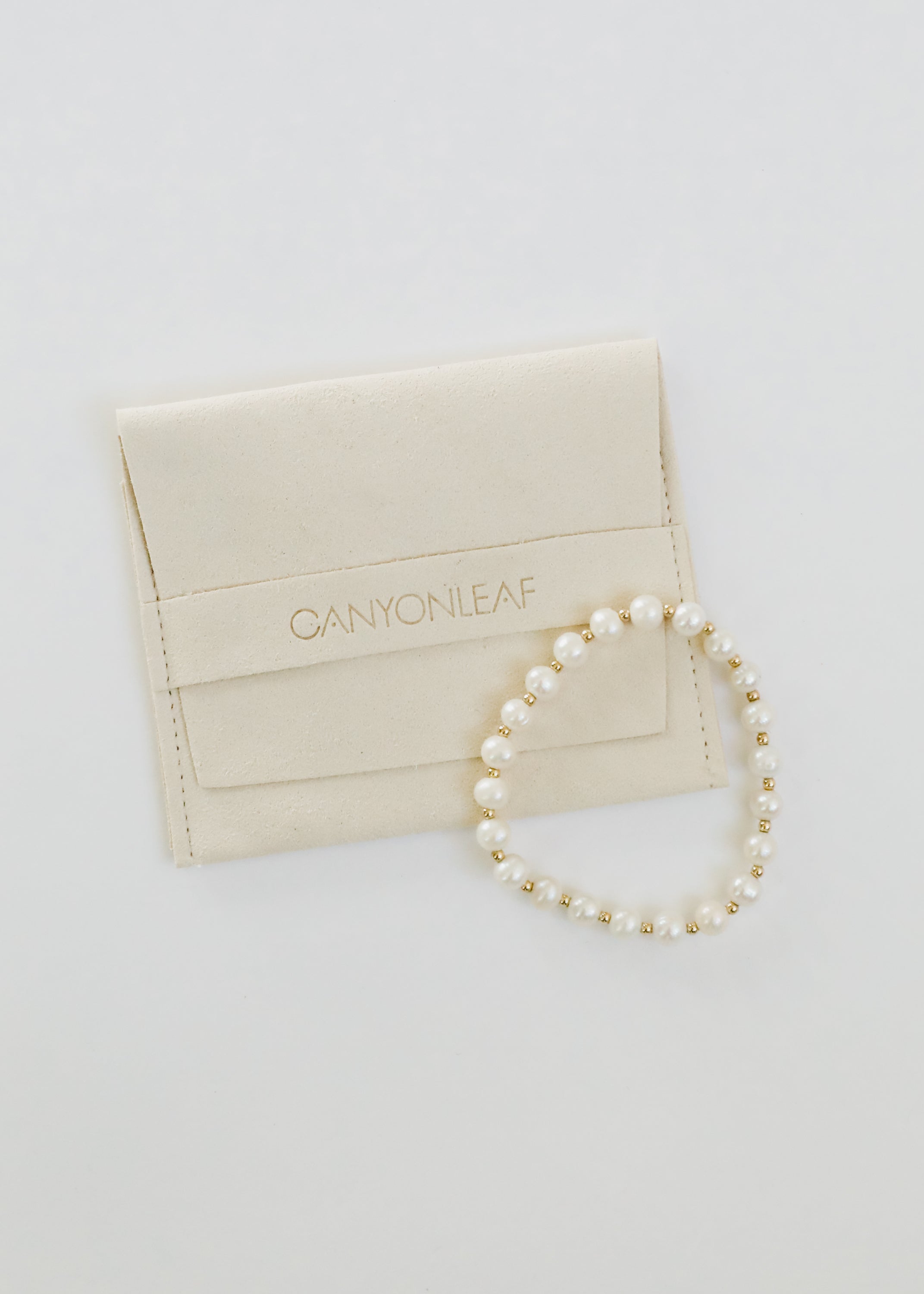 CanyonLeaf Pearl : 14k Gold Filled Sun + Moon || Stretch Bracelets — CanyonLeaf branding close-up