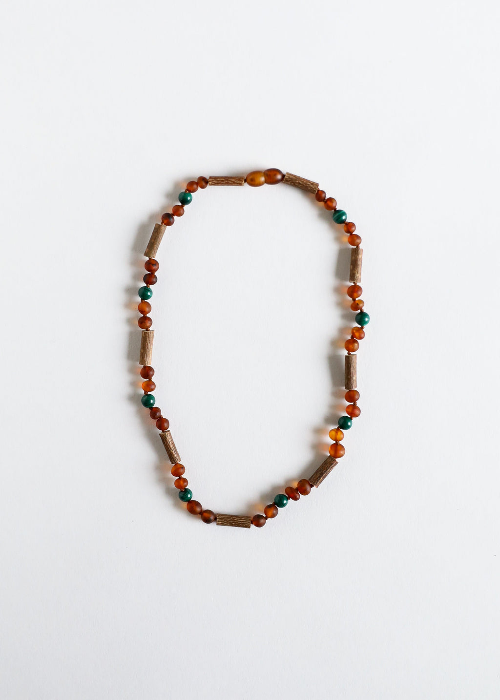 CanyonLeaf Hazelwood || Raw Cognac Baltic Amber + Malachite || Necklace — lifestyle worn / used context