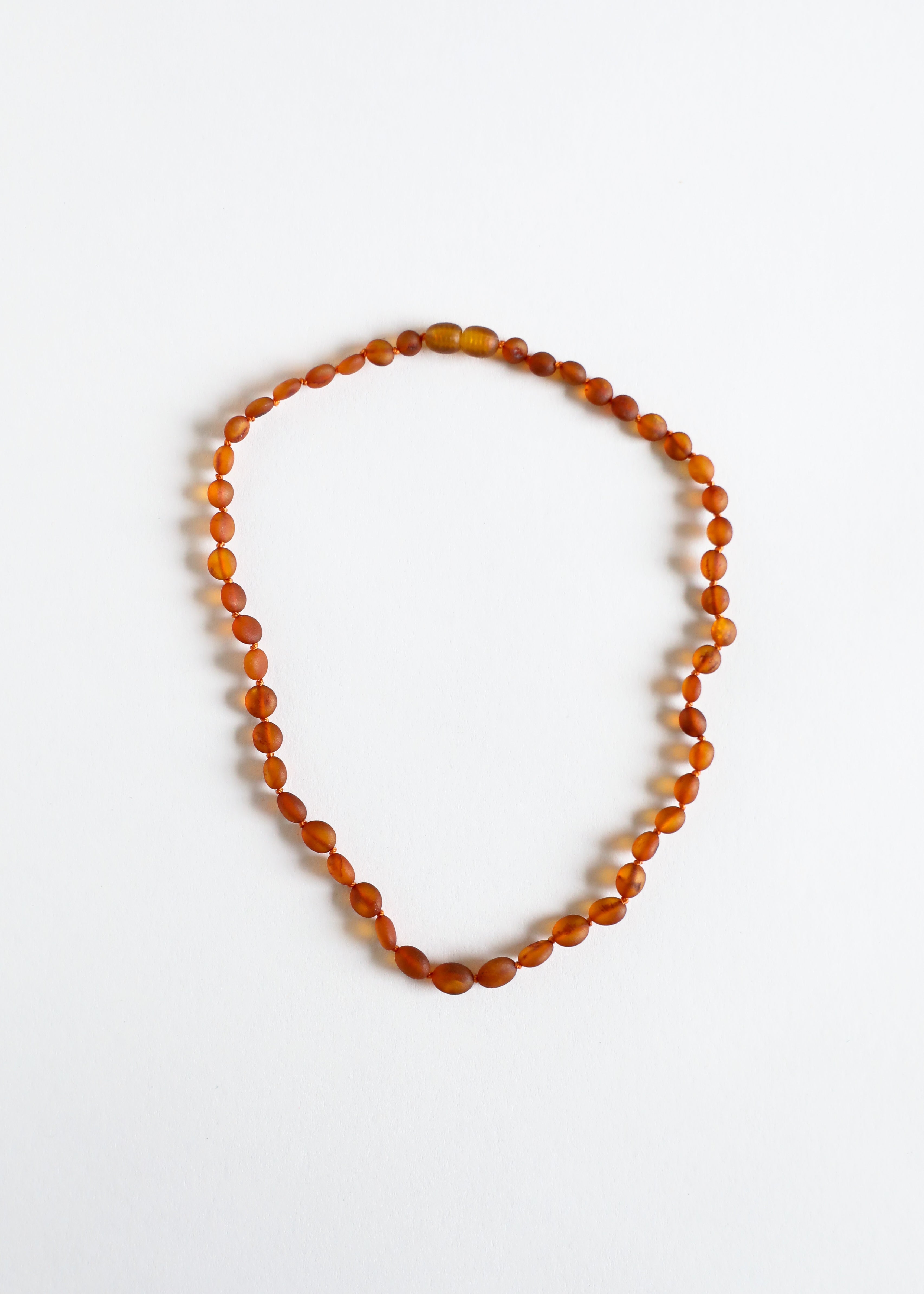 CanyonLeaf Raw Cognac Baltic Amber || Classic || Necklace — CanyonLeaf branding close-up