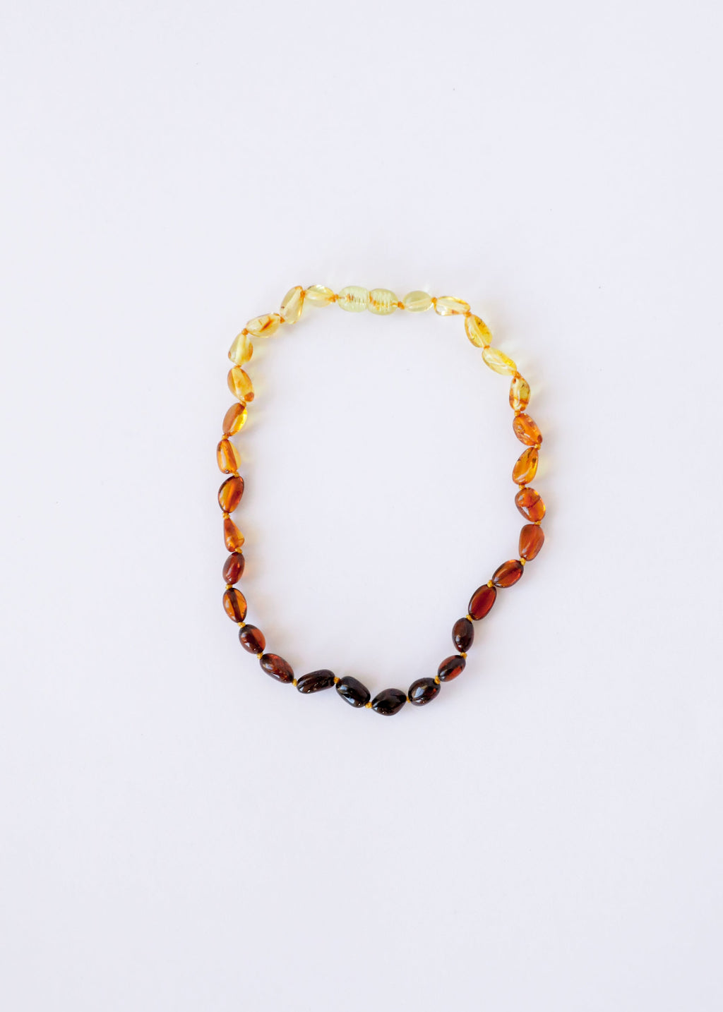 CanyonLeaf Polished Ombre Baltic Amber || Necklace — CanyonLeaf branding close-up