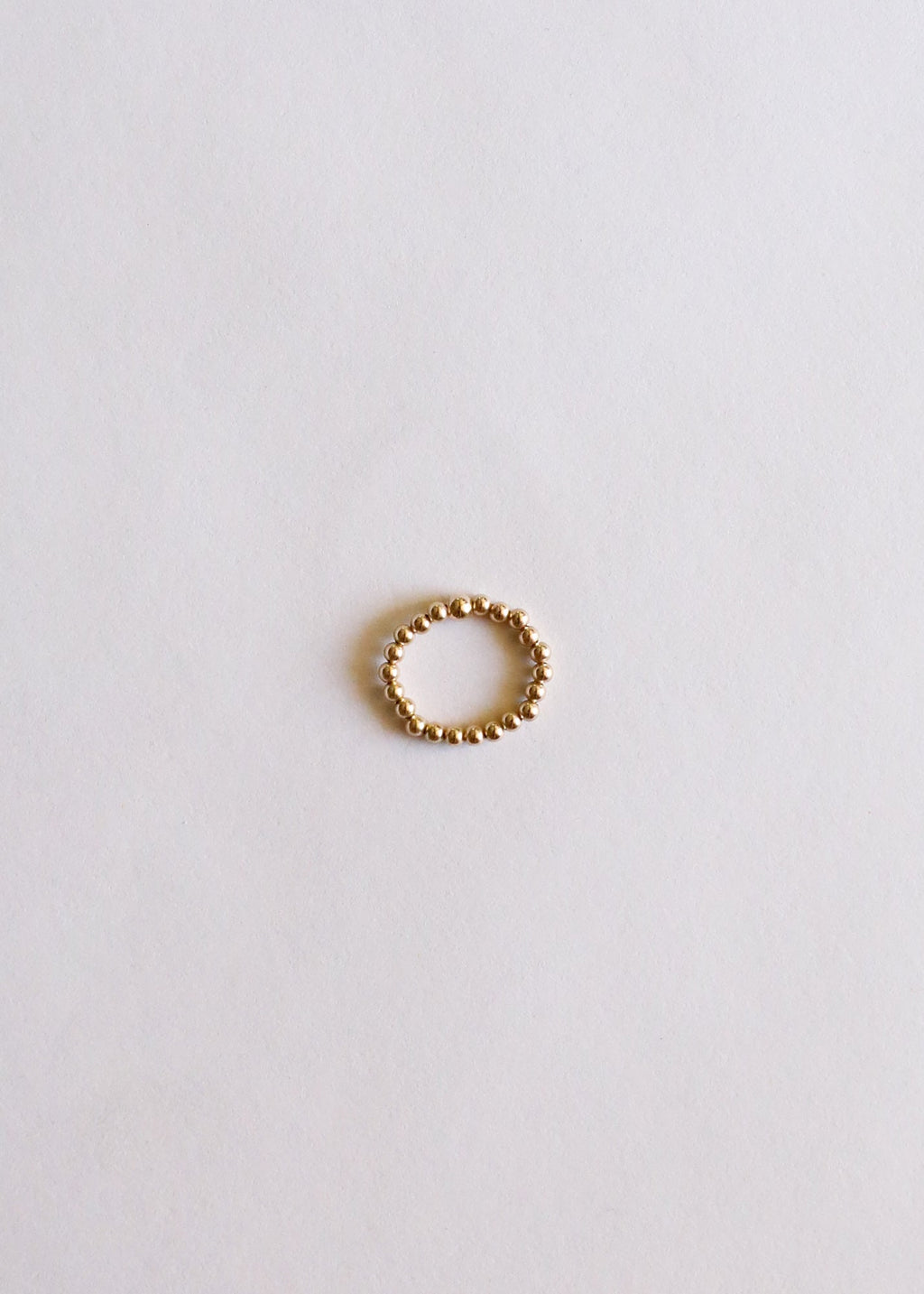 CanyonLeaf Raw Cognac Baltic Amber + 14K Gold Filled Beaded Ring Stack — lifestyle context