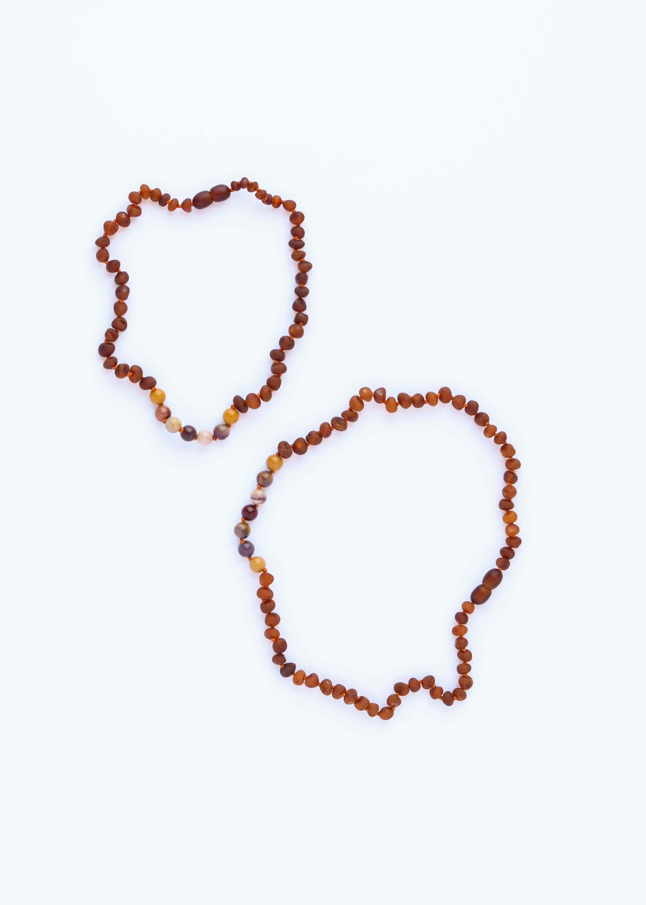 CanyonLeaf Raw Cognac Baltic Amber + Mookaite Jasper || Necklace — CanyonLeaf branding close-up