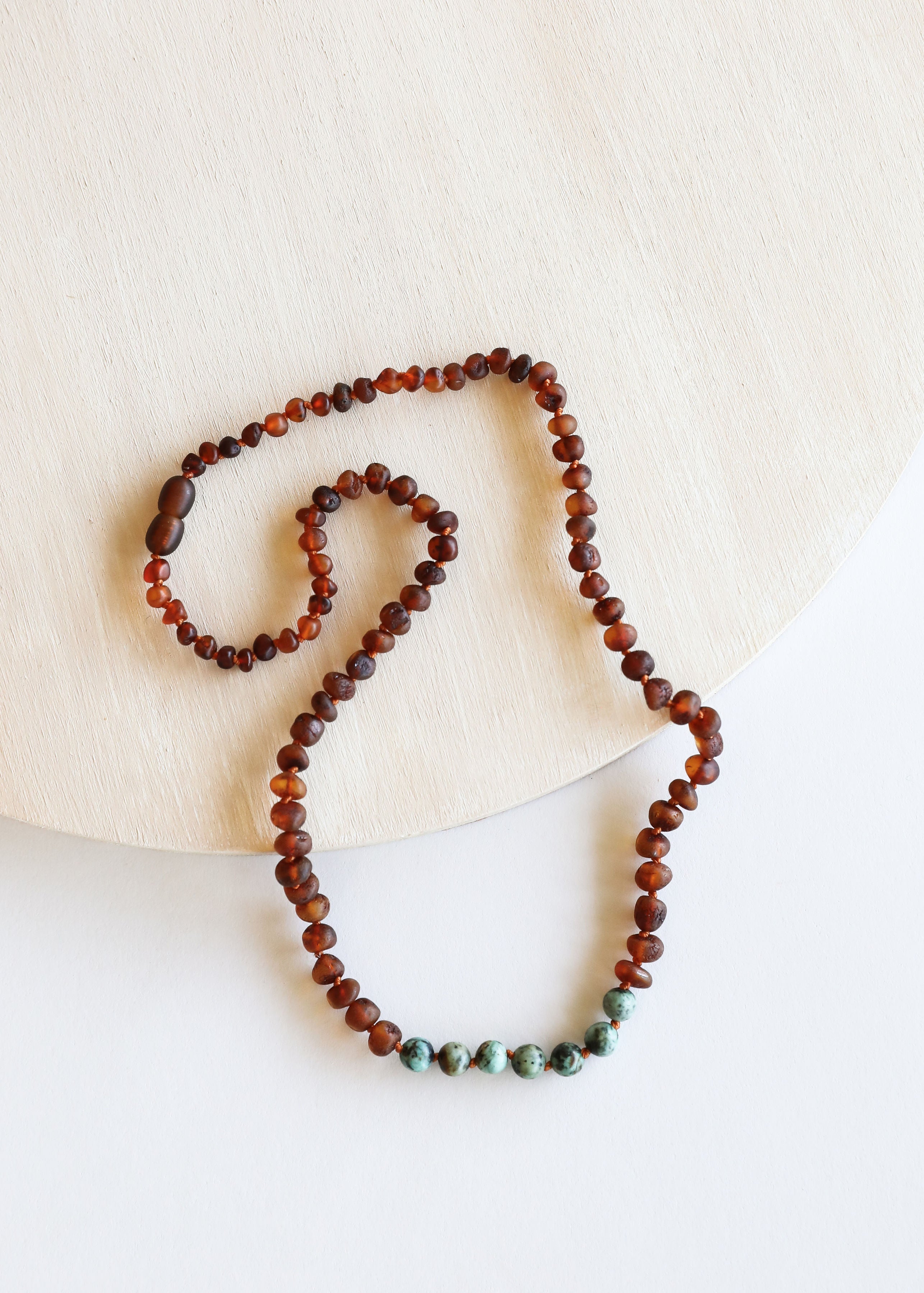 CanyonLeaf Raw Cognac Baltic Amber + Turquoise Jasper || Necklace Set — CanyonLeaf branding close-up