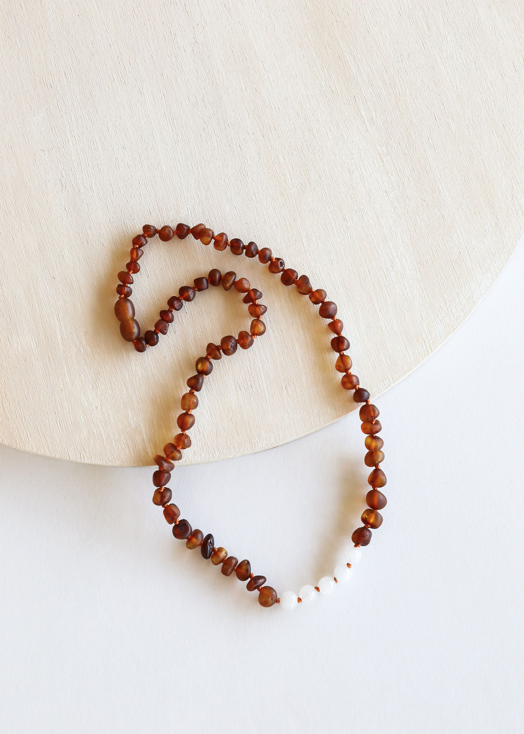CanyonLeaf Raw Cognac Baltic Amber + Moonstone || Necklace — CanyonLeaf branding close-up