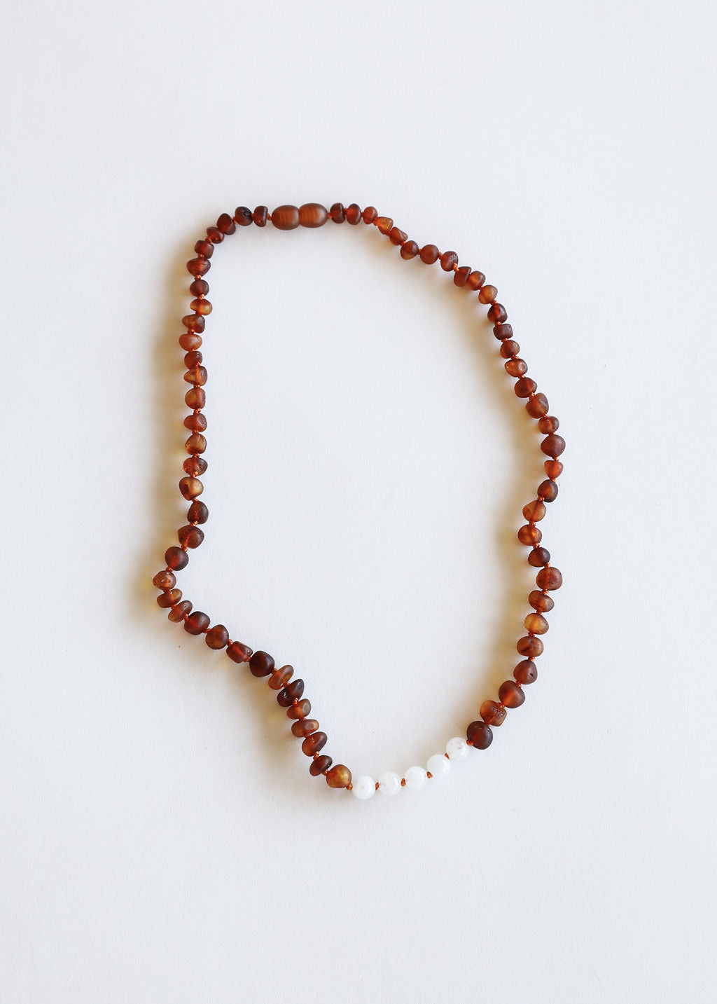 CanyonLeaf Raw Cognac Baltic Amber + Moonstone || Necklace — lifestyle worn / used context
