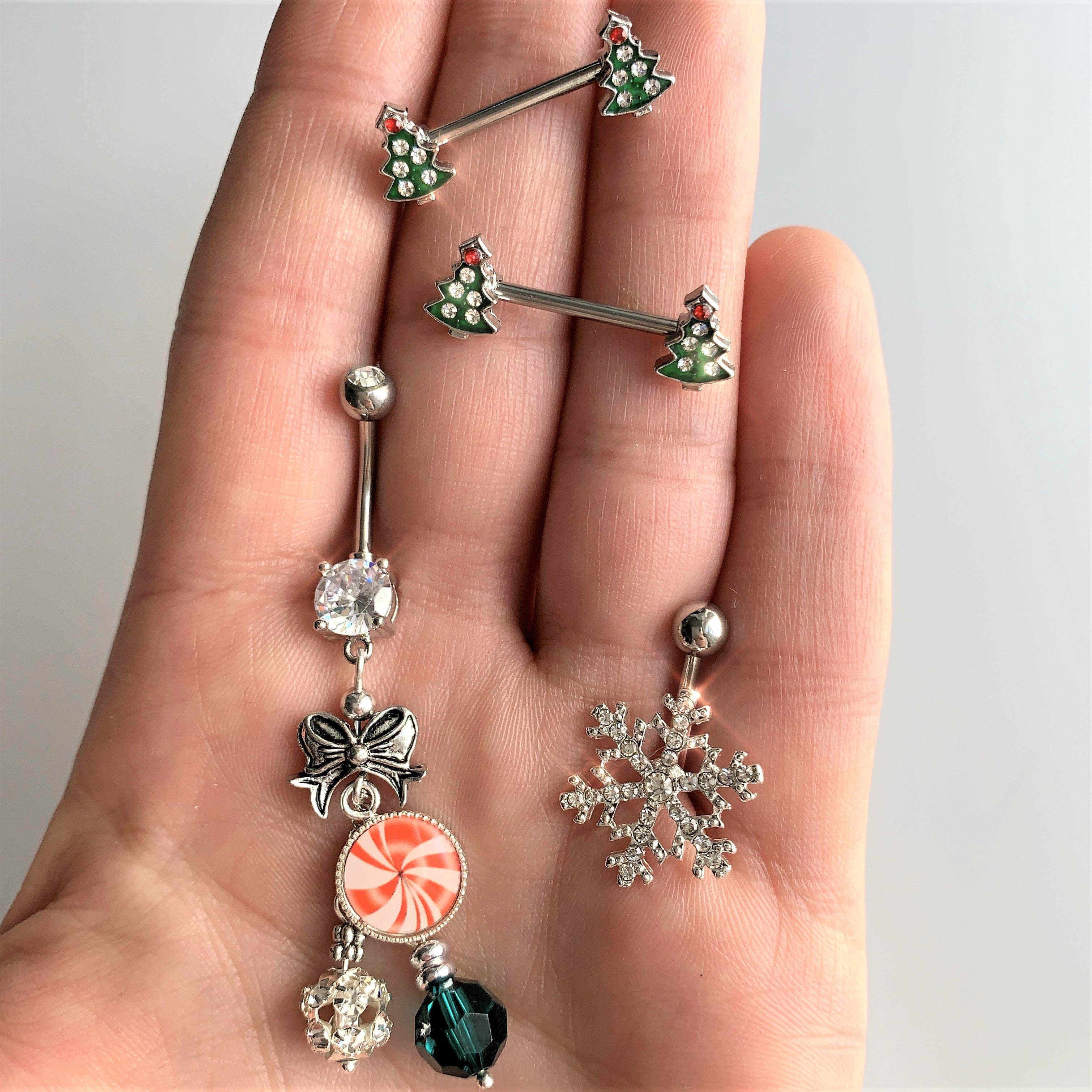 BodyCandy 14G 9/16 Clear Red Gem Christmas Tree Barbell Nipple Ring Set — detail close-up