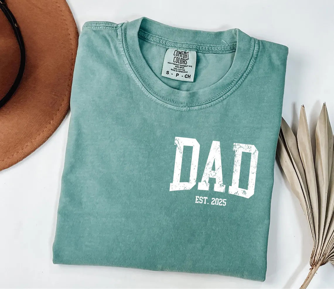 A Blessed Texas Mess Boutique Comfort Colors®  Custom New Dad Shirt EST year Father's Day Daddy Pocket… — lifestyle worn / used context