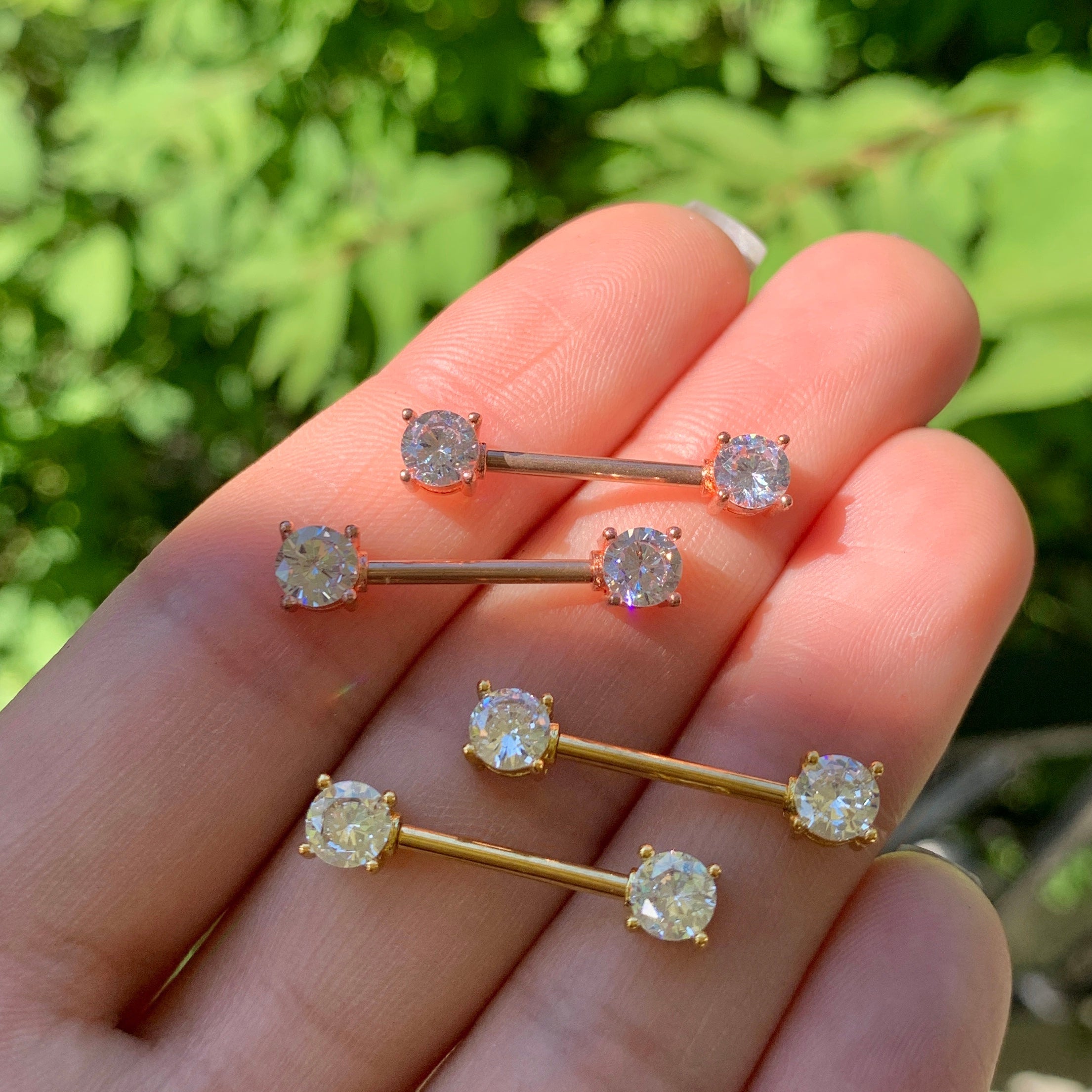 BodyCandy 14G 9/16 Aurora CZ Gem Rose Gold Tone Barbell Nipple Ring Set — lifestyle context