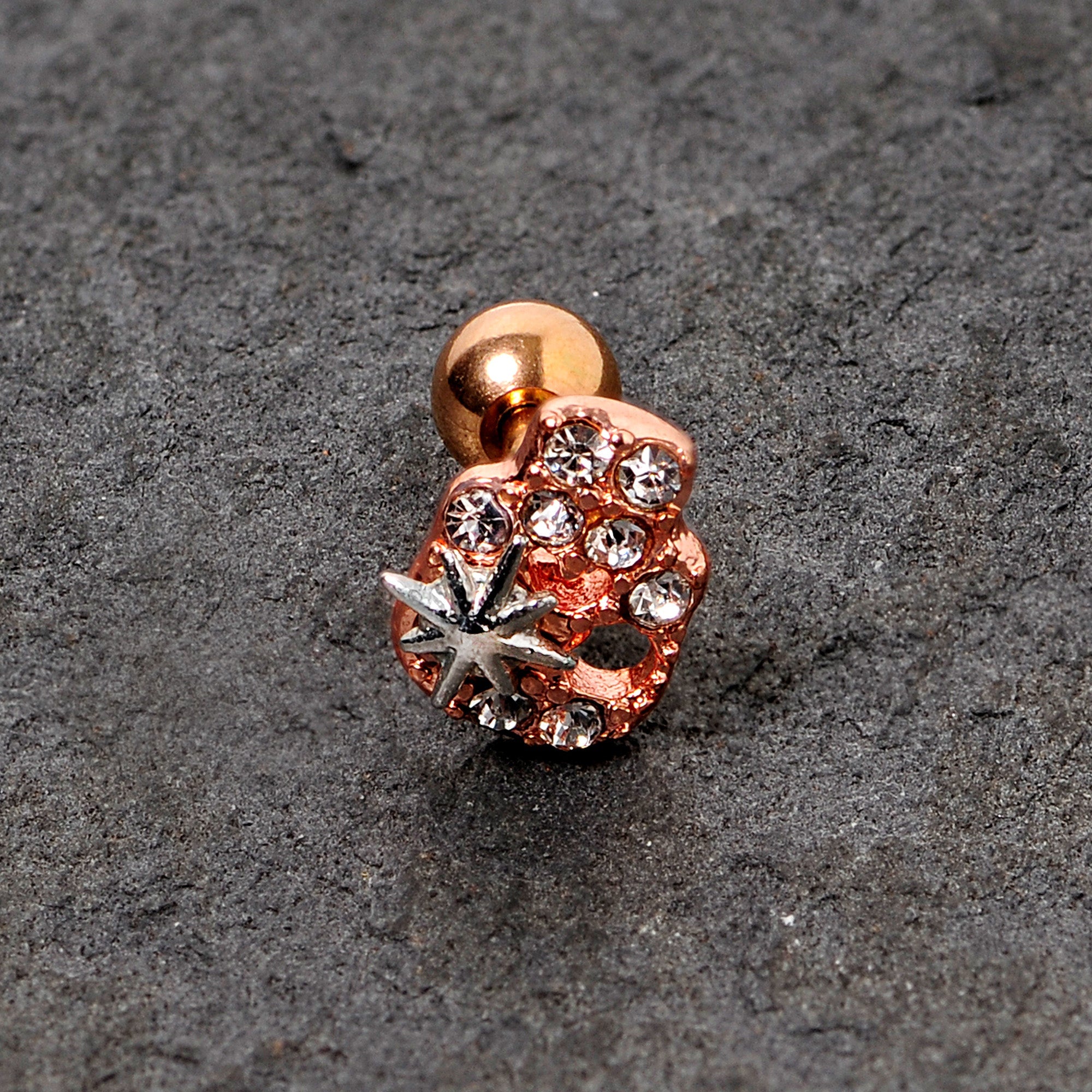 BodyCandy 16G 1/4 Clear Gem Rose Gold Tone Star Skull Cartilage Tragus — lifestyle context