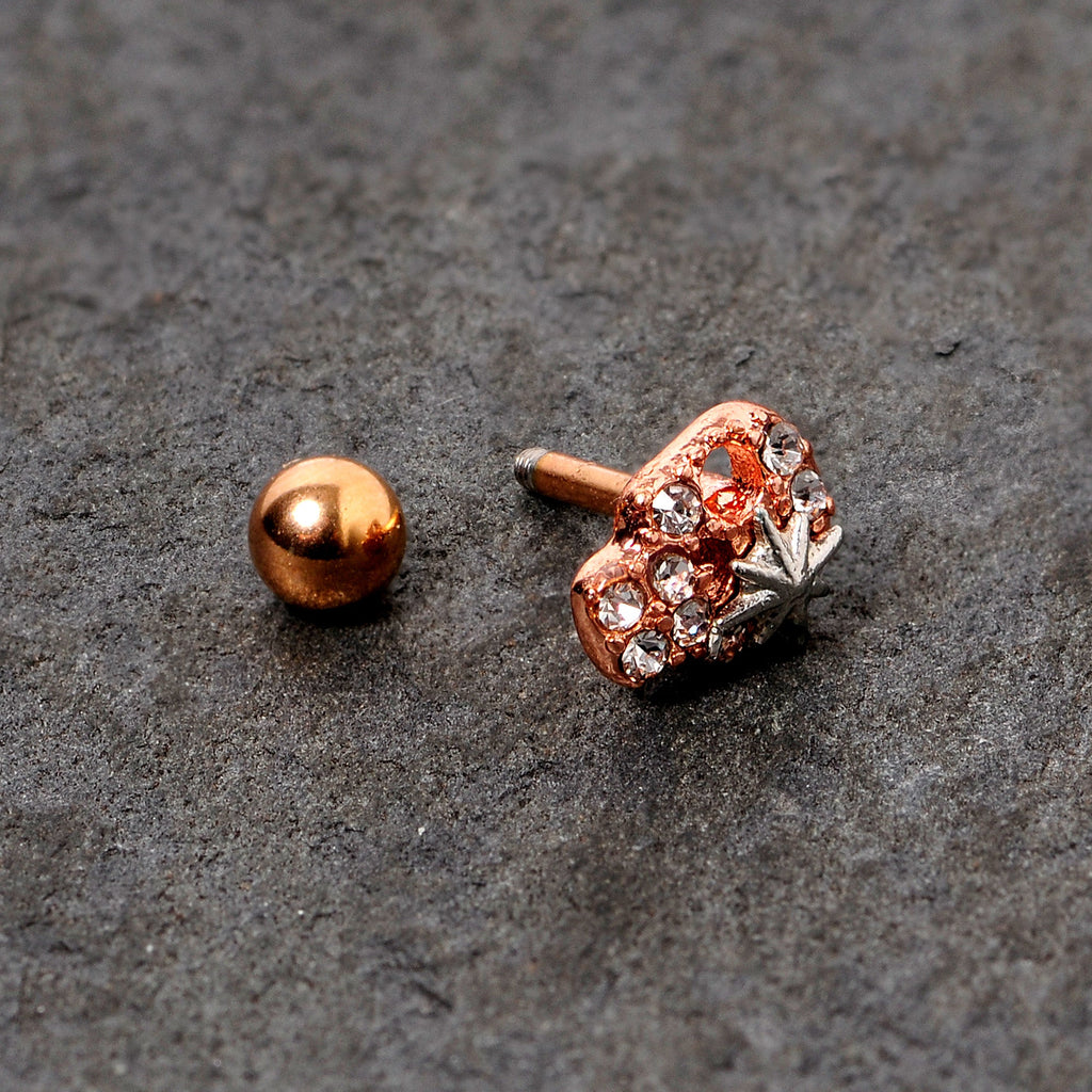 BodyCandy 16G 1/4 Clear Gem Rose Gold Tone Star Skull Cartilage Tragus — side view