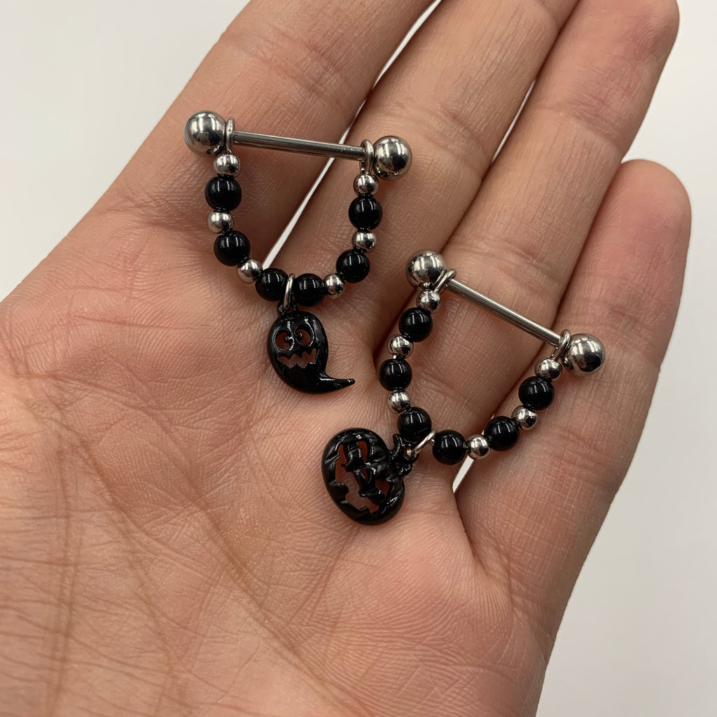 BodyCandy 14G 5/8 Black Pumpkin Ghost Halloween Dangle Nipple Ring Set — detail close-up