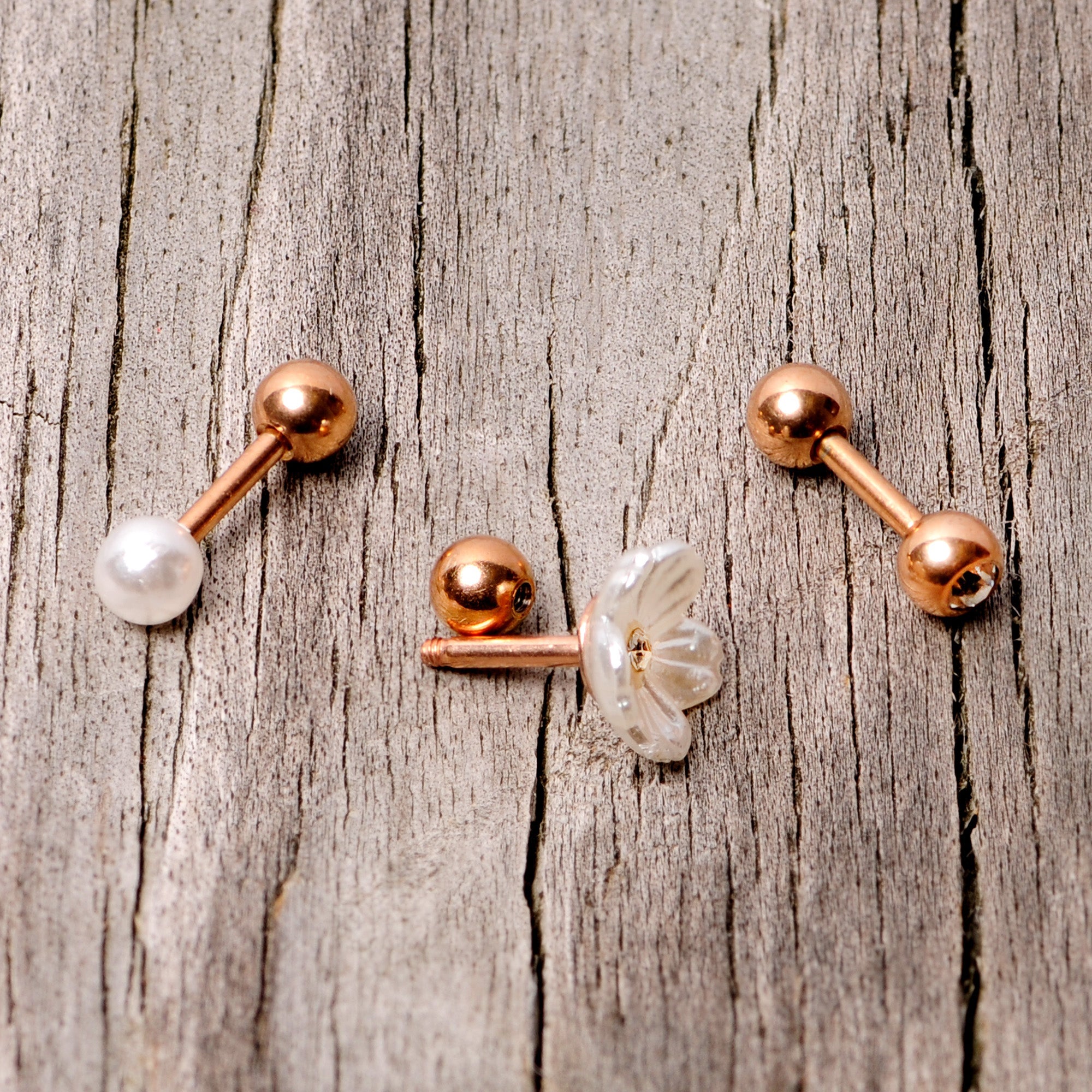 BodyCandy 16G 1/4 Clear Gem Rose Gold Tone Flower Cartilage Tragus Curation Set of 3 — side view
