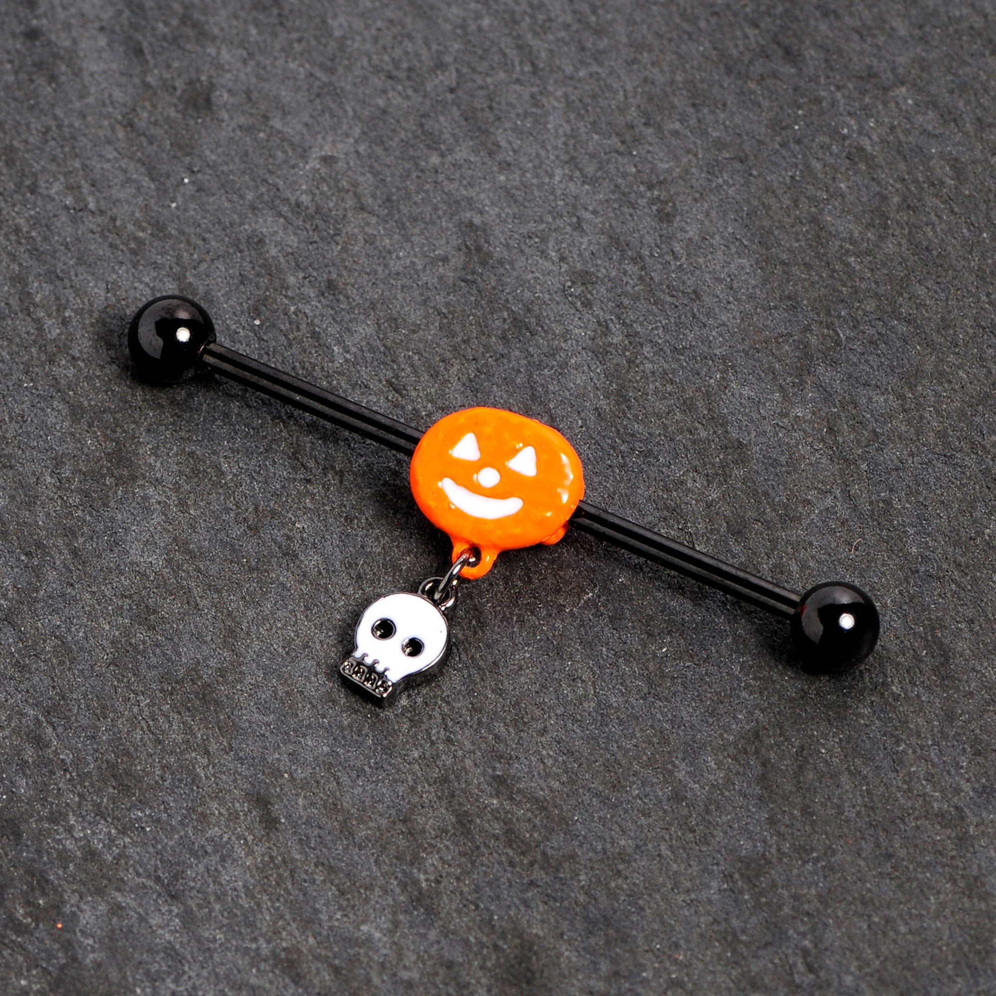 BodyCandy 14G Orange Pumpkin Skull Halloween Dangle Industrial Barbell 38mm — detail close-up