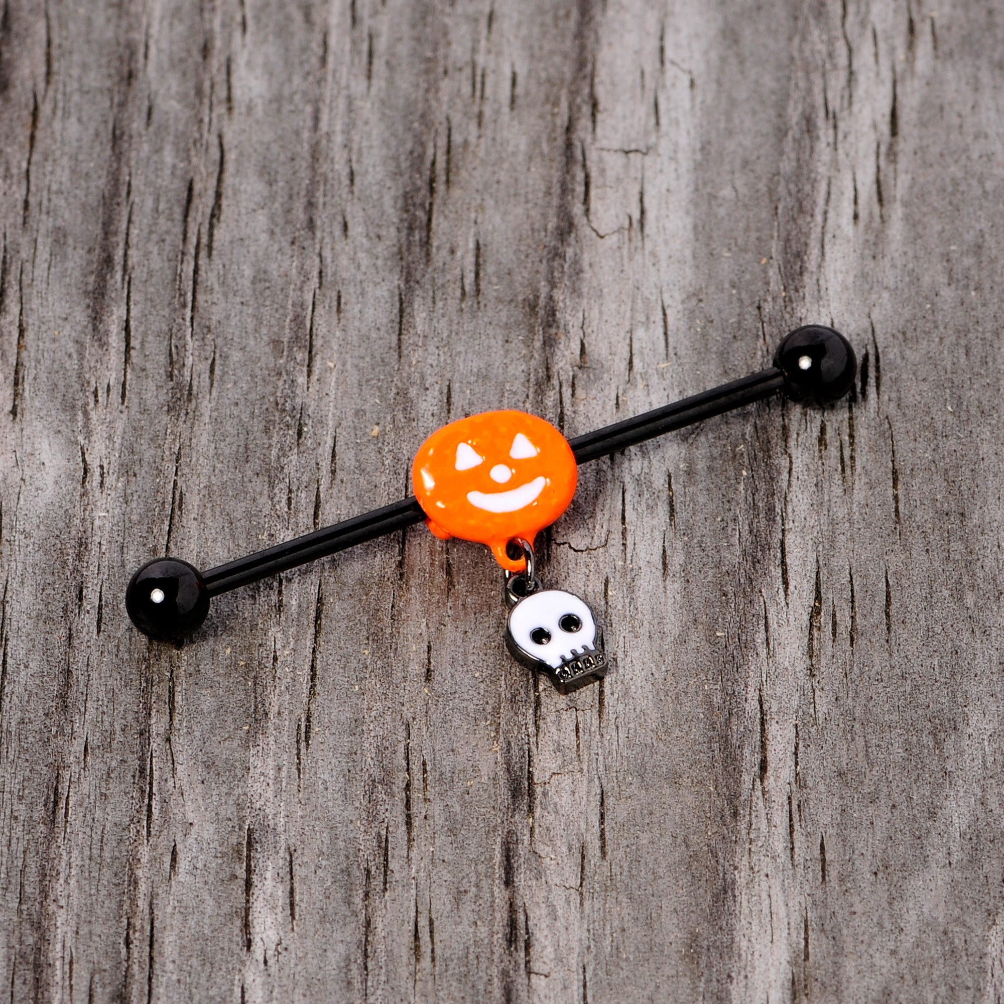 BodyCandy 14G Orange Pumpkin Skull Halloween Dangle Industrial Barbell 38mm — lifestyle context