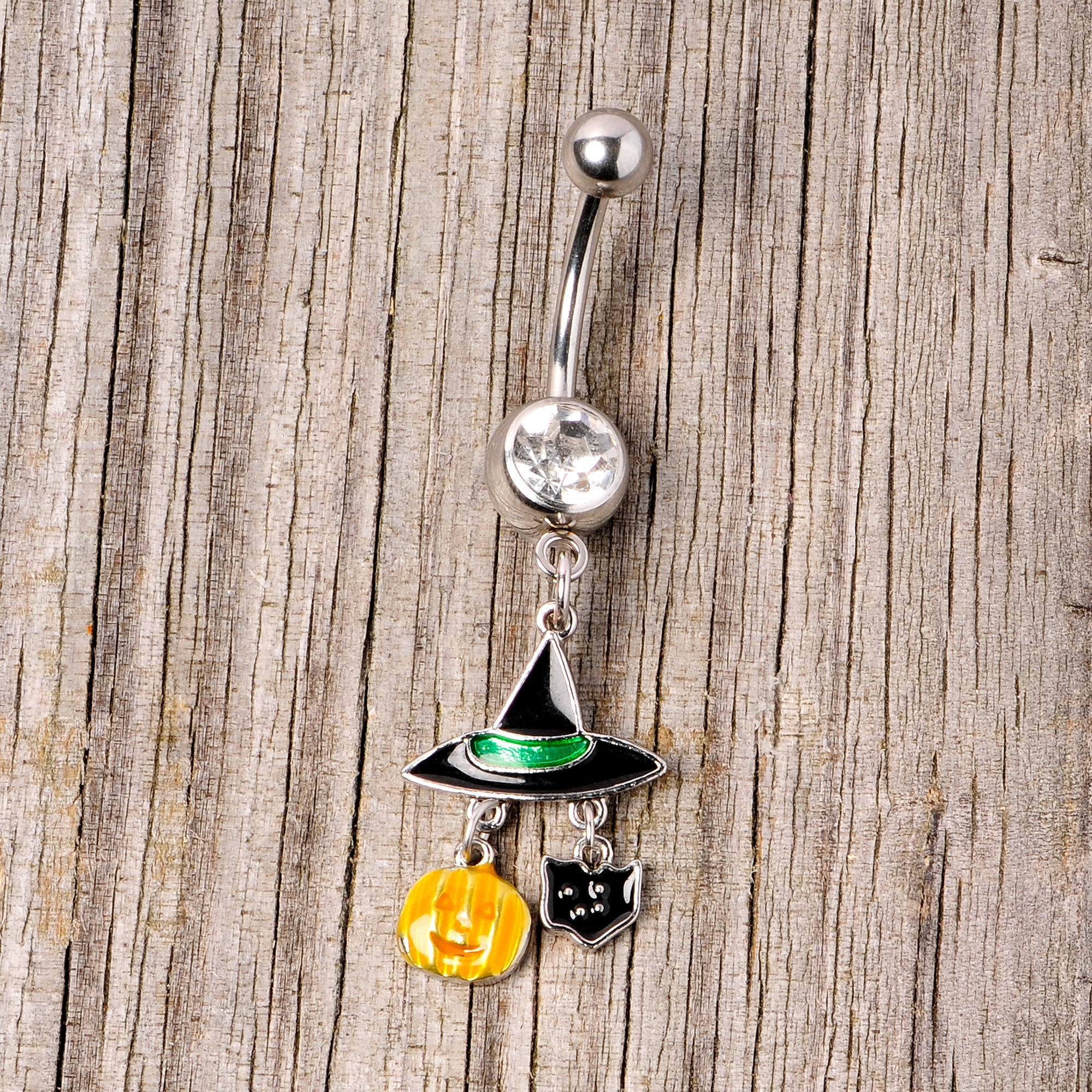 BodyCandy Clear Gem Witch Hat Bat Orange Pumpkin Halloween Dangle Belly Ring — side view