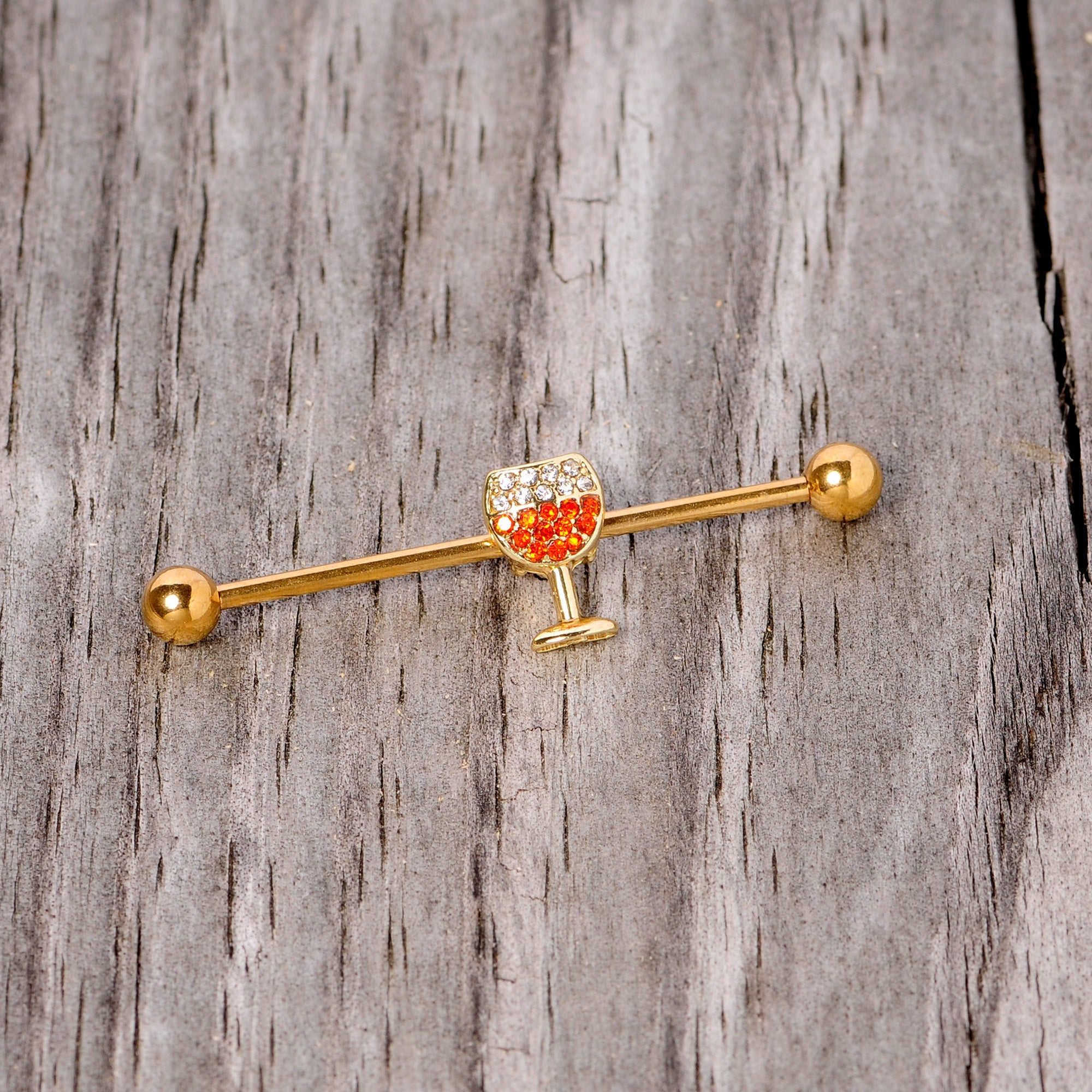 BodyCandy Orange Gem Gold Tone Holiday Wine Halloween Industrial Barbell 38mm — in-use photo