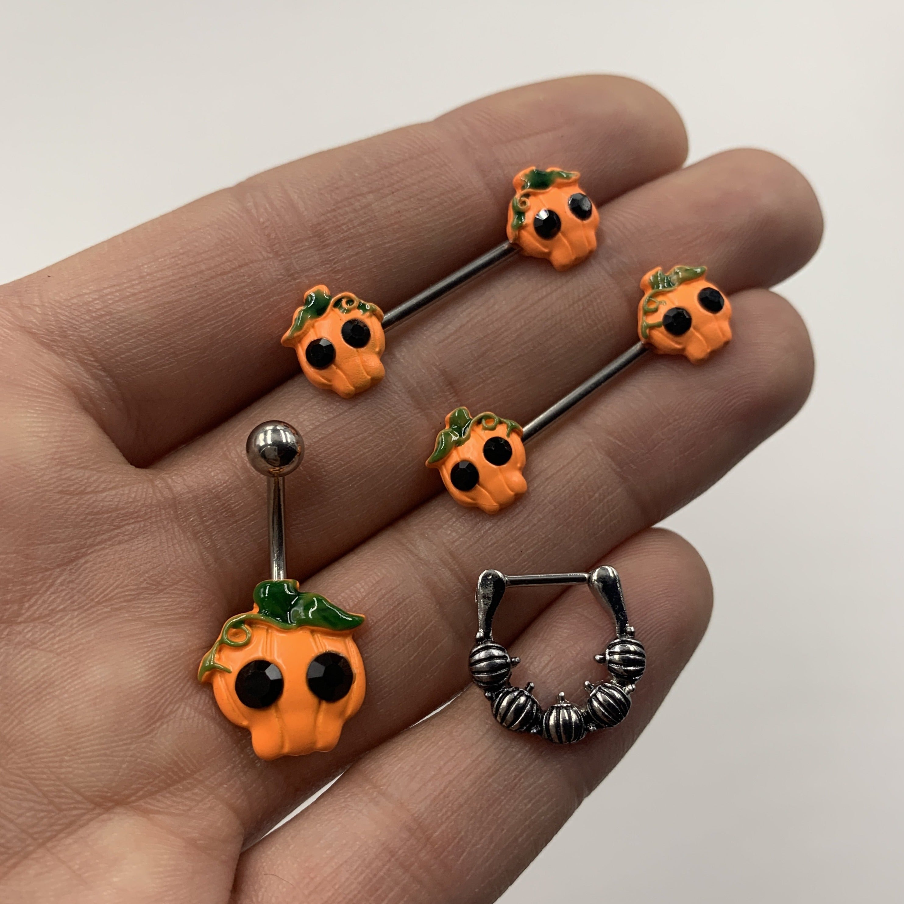 BodyCandy 14G 5/8 Orange Jack O Lantern Pumpkin Halloween Nipple Ring Set — detail close-up