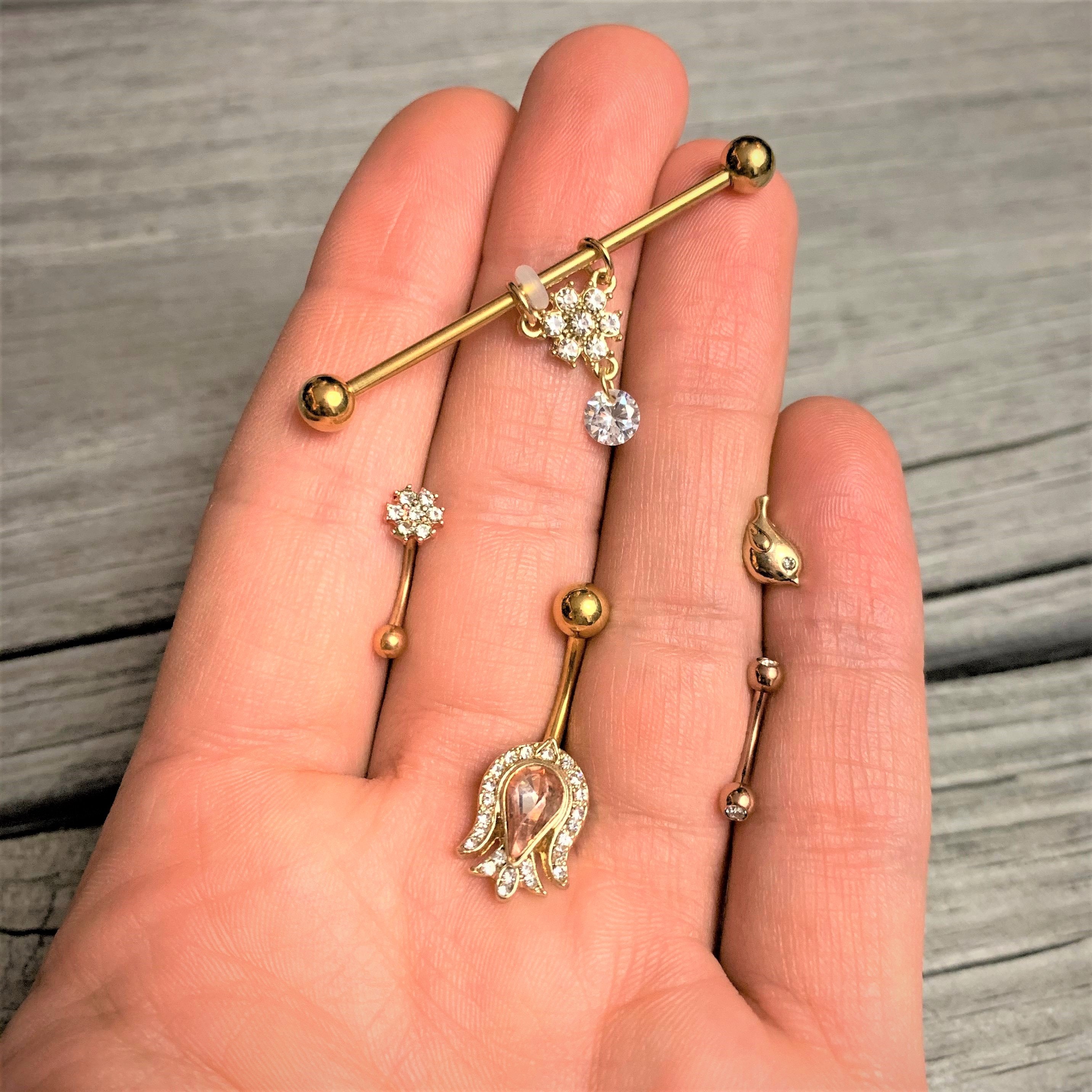 BodyCandy 16G 1/4 Clear Gem Gold Tone Little Bird Cartilage Tragus Earring — detail close-up