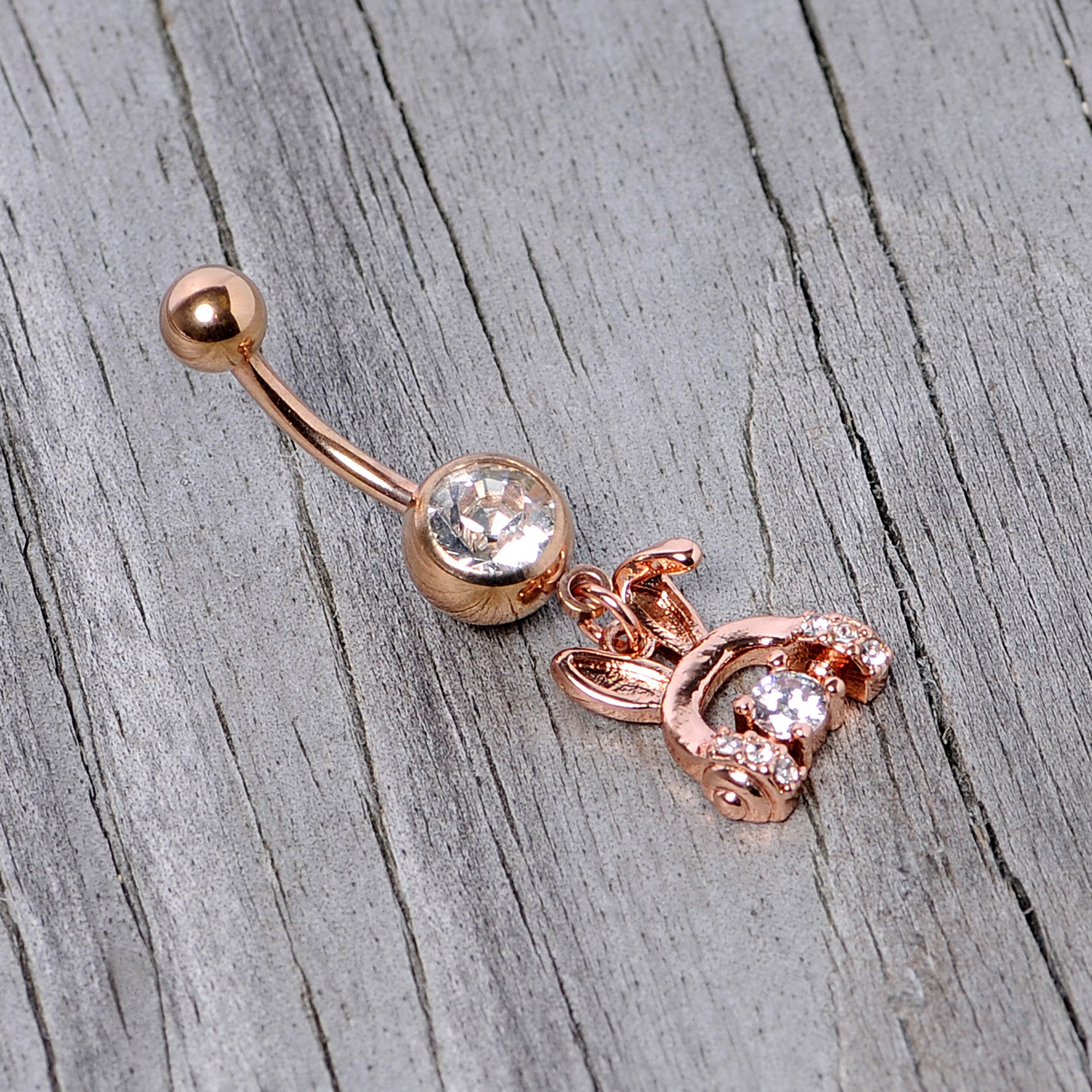BodyCandy Clear Gem Rose Gold Tone Bunny Ear Headphones Dangle Belly Ring — lifestyle context