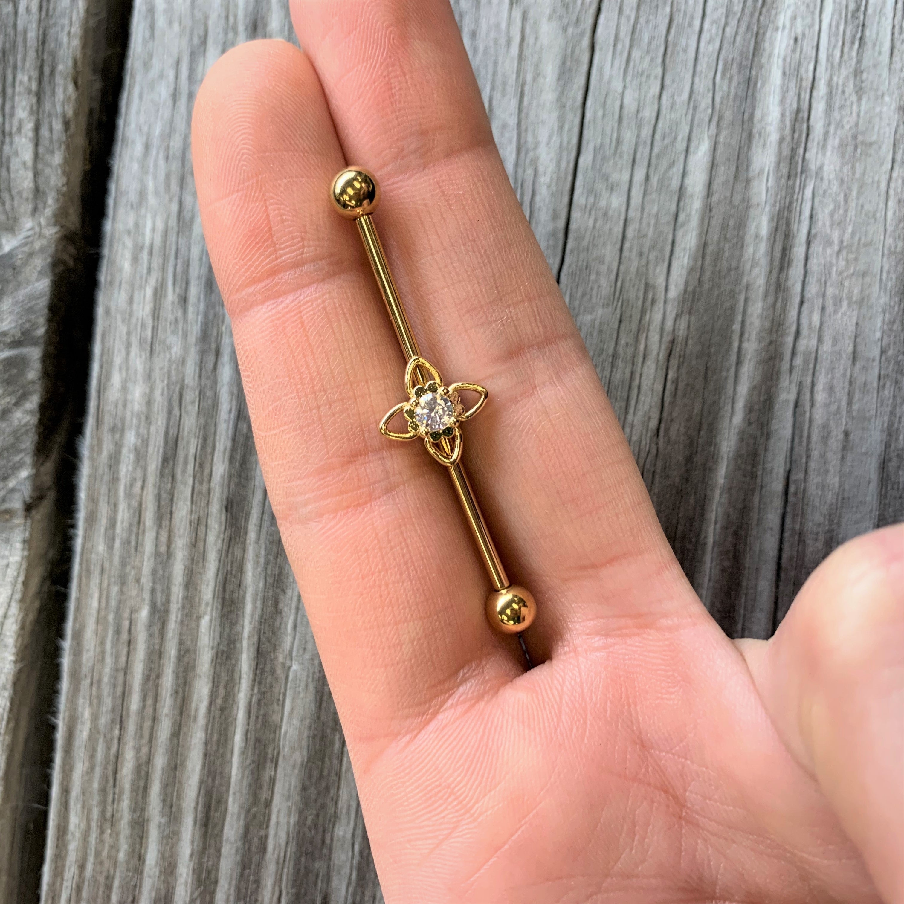 BodyCandy 14G Clear CZ Gem Gold Tone Open Flower Industrial Barbell 38mm — detail close-up