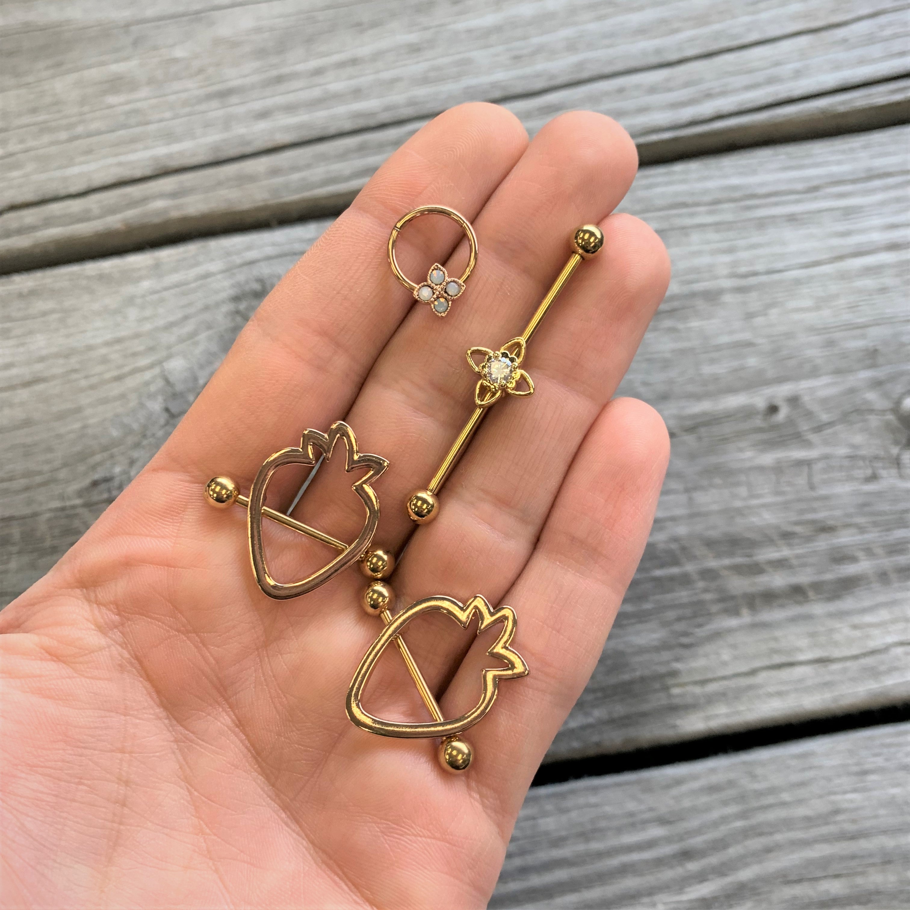 BodyCandy 14G Clear CZ Gem Gold Tone Open Flower Industrial Barbell 38mm — lifestyle context