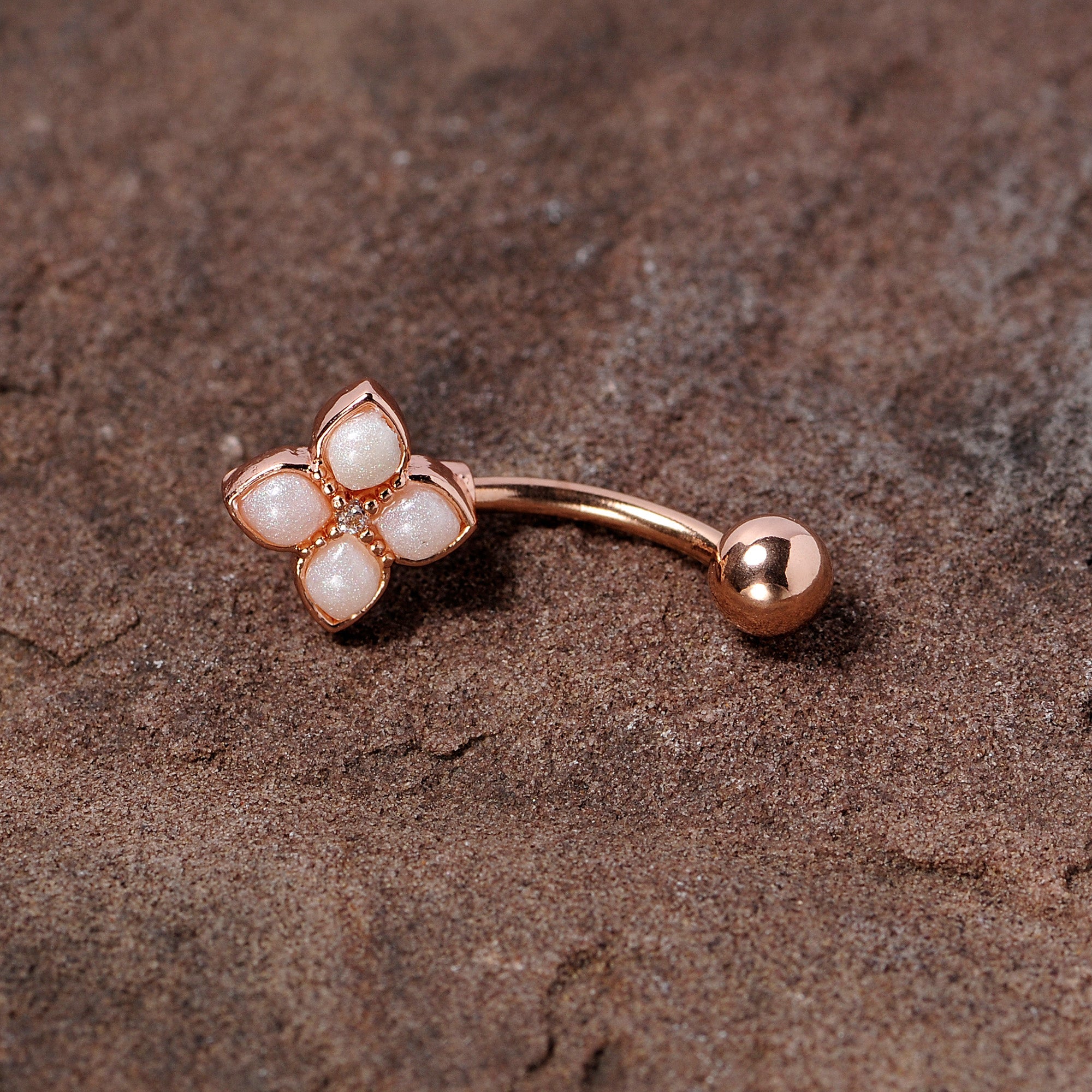 BodyCandy 16G 5/16 Clear Gem Rose Gold Tone Rhombus Curved Eyebrow Ring — detail close-up