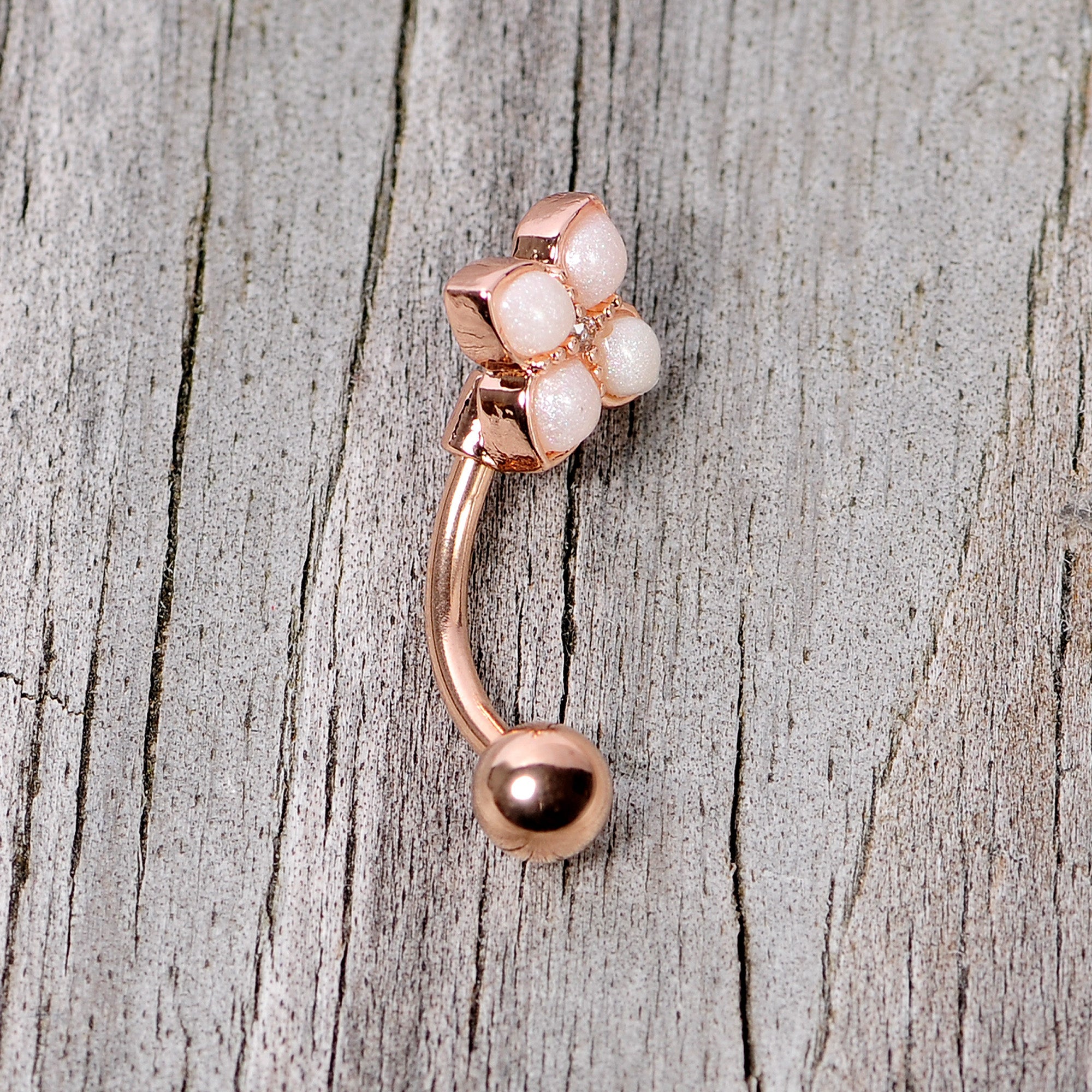 BodyCandy 16G 5/16 Clear Gem Rose Gold Tone Rhombus Curved Eyebrow Ring — lifestyle context