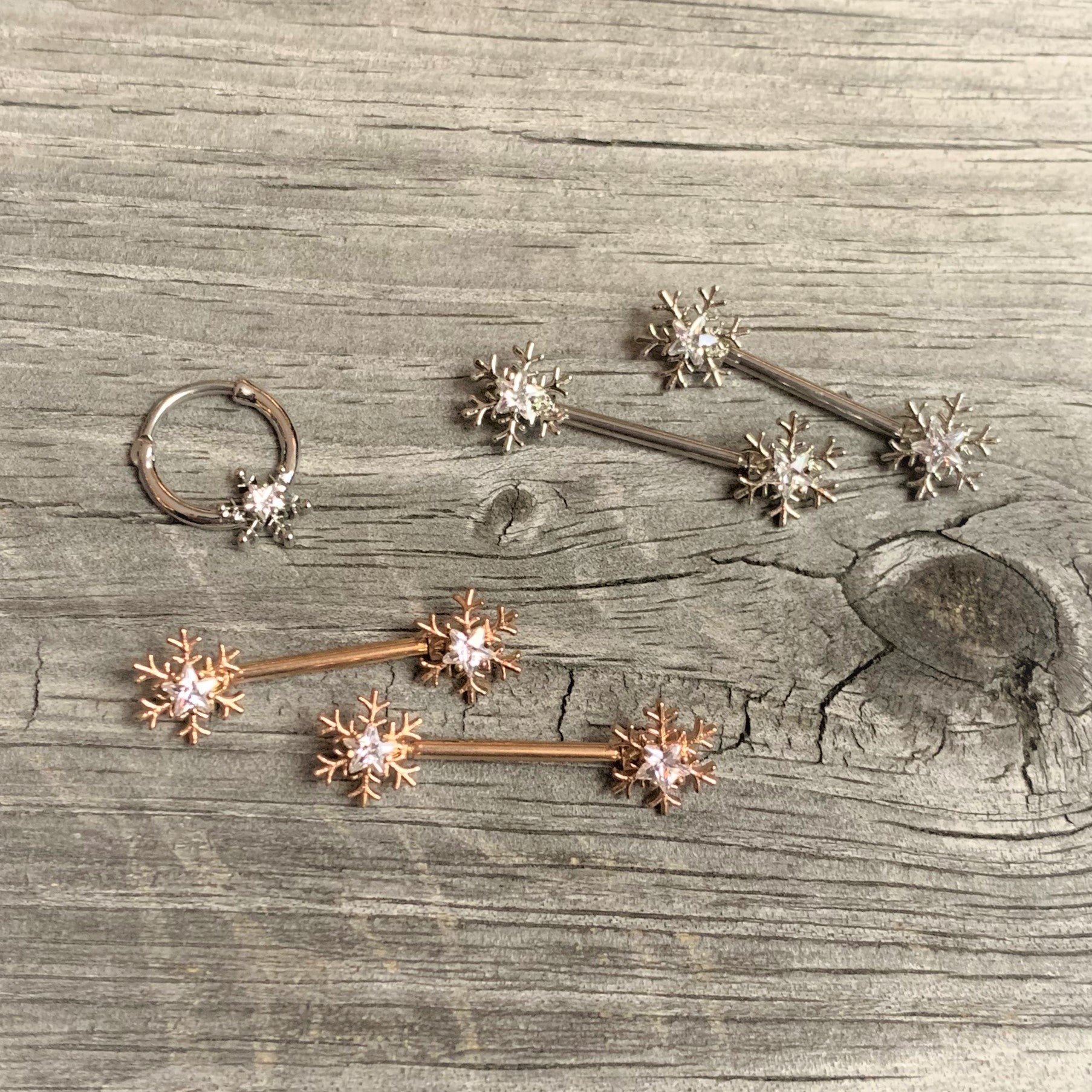 BodyCandy 16G 3/8 Clear Gem Holiday Snowflake Septum Clicker — side view