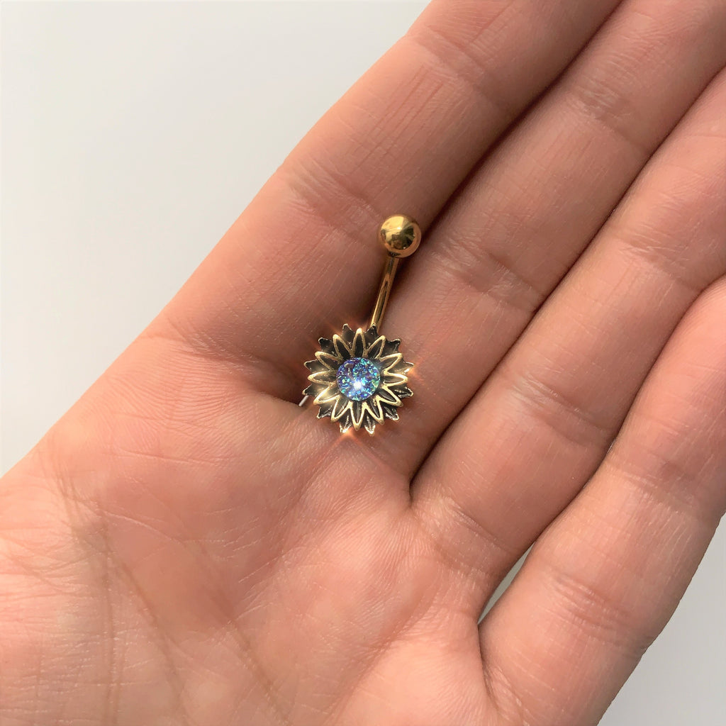 BodyCandy Gold Tone Aqua Center Sunburst Flower Belly Ring — lifestyle context