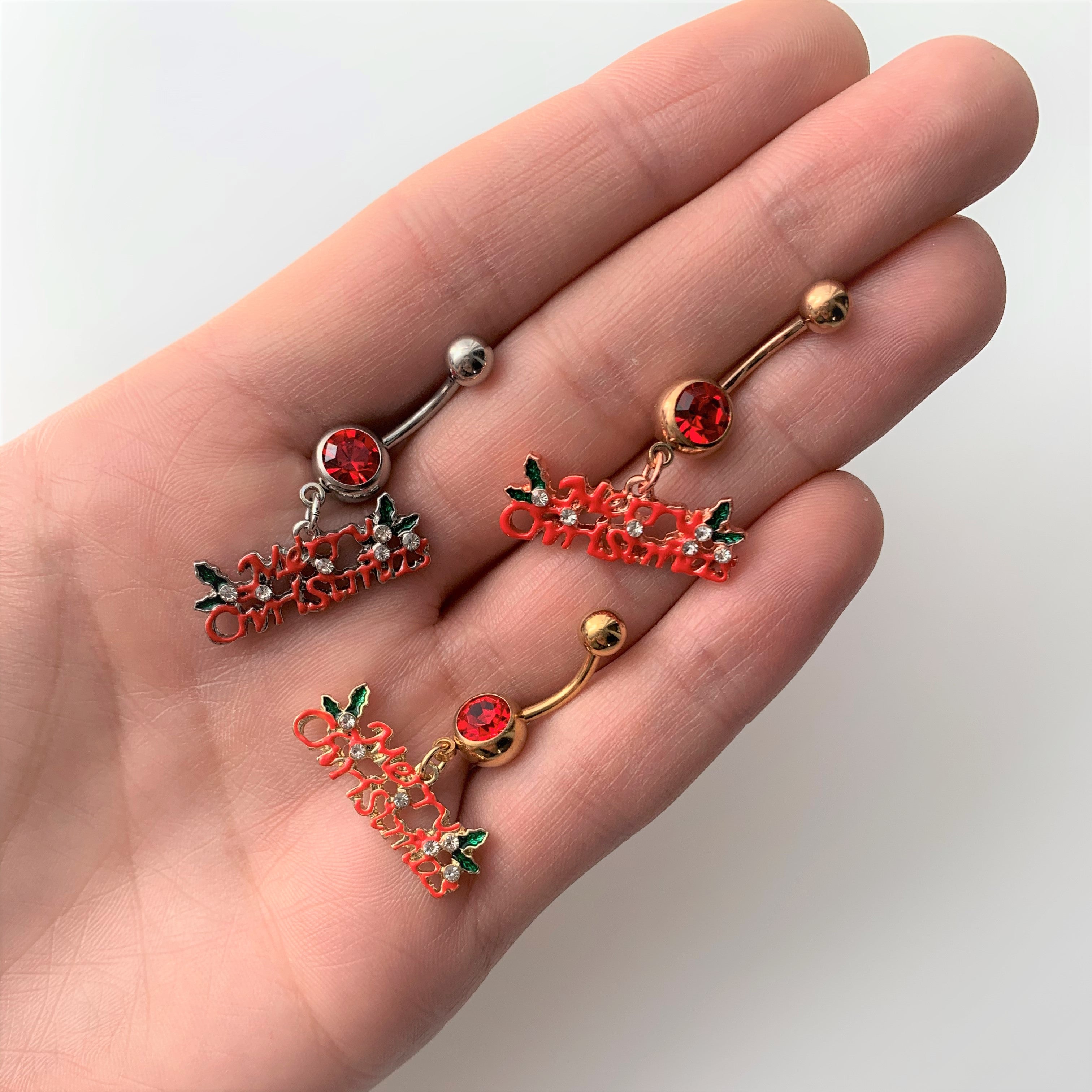 BodyCandy Red Gem Rose Gold Tone Merry Christmas Dangle Belly Ring — detail close-up