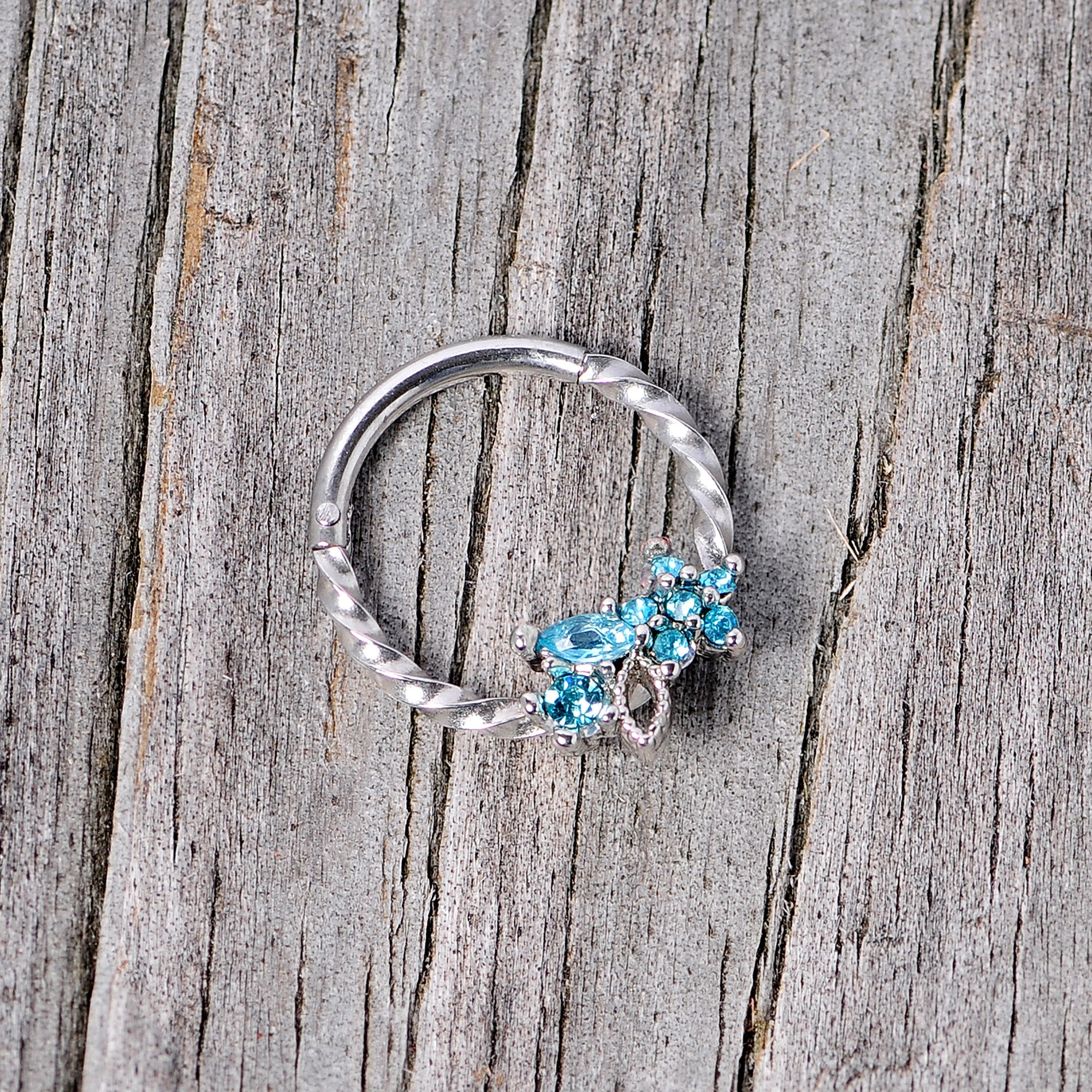 BodyCandy 16G 3/8 Aqua Gem Star Twisted Hinged Segment Ring — lifestyle context