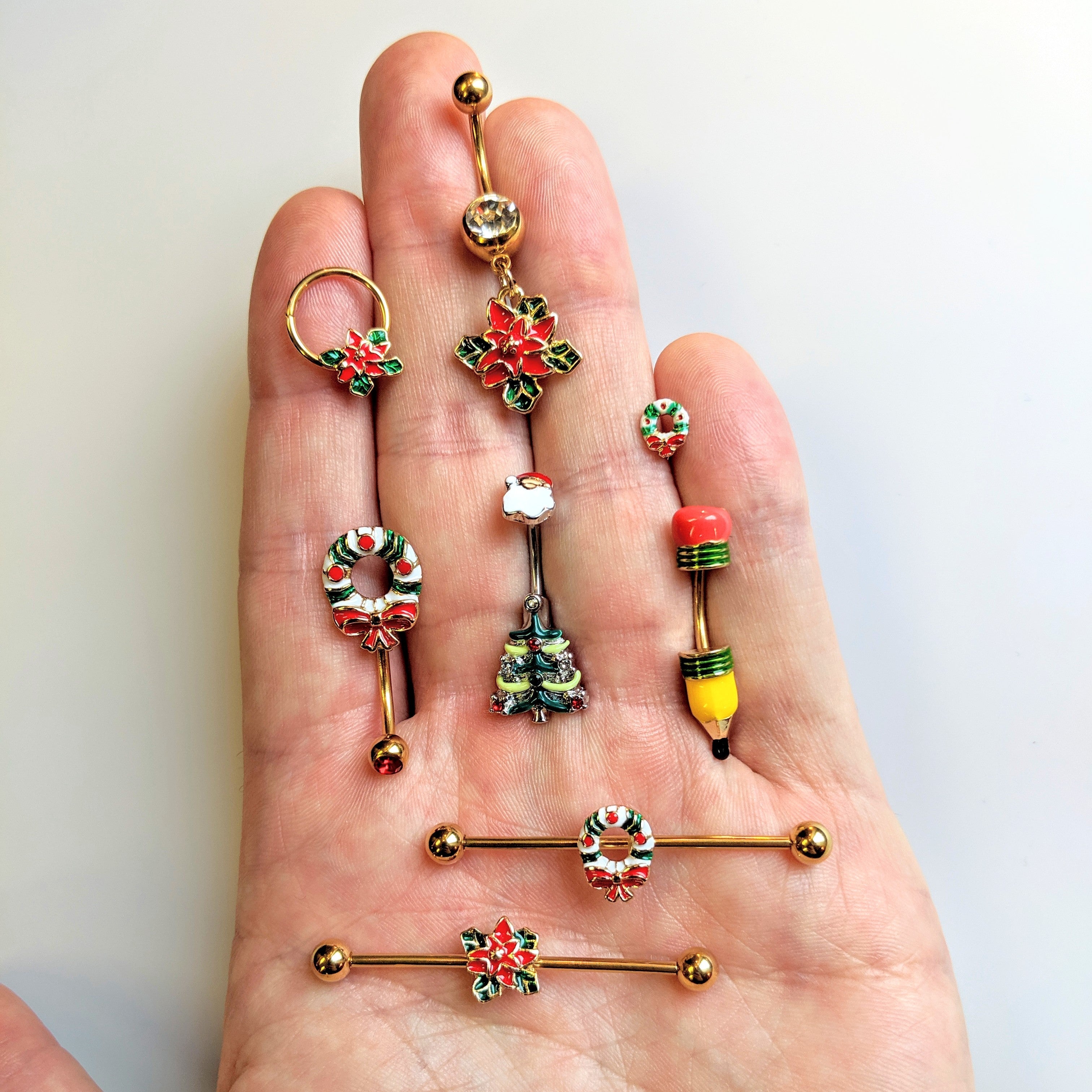 BodyCandy Clear Gem Gold Tone Poinsettia Christmas Dangle Belly Ring — detail close-up