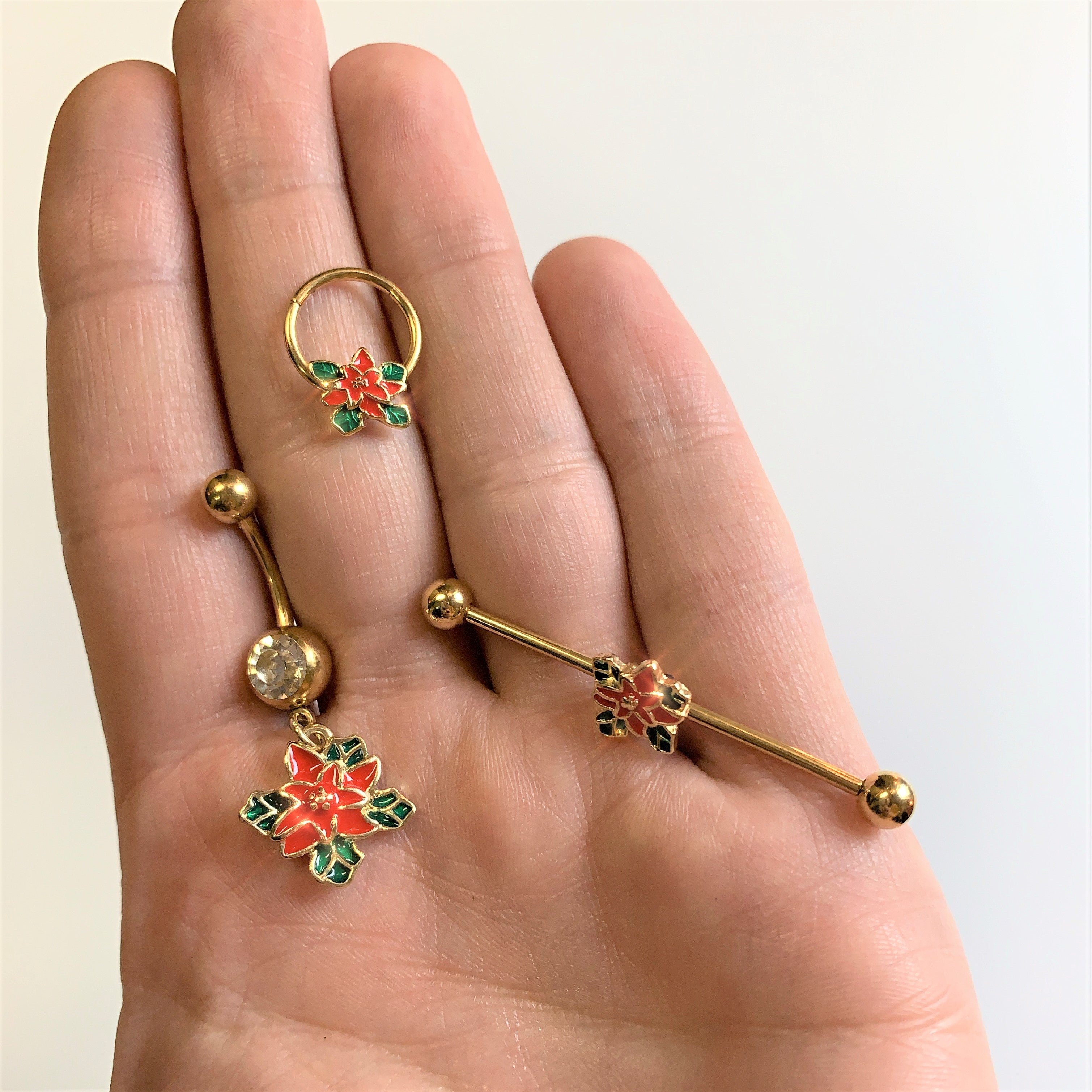 BodyCandy Clear Gem Gold Tone Poinsettia Christmas Dangle Belly Ring — lifestyle context