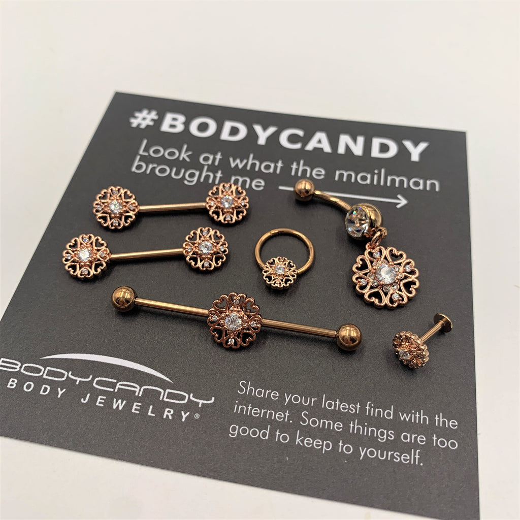 BodyCandy 14G Clear CZ Gem Rose Gold Tone Hearts Industrial Barbell 38mm — lifestyle context