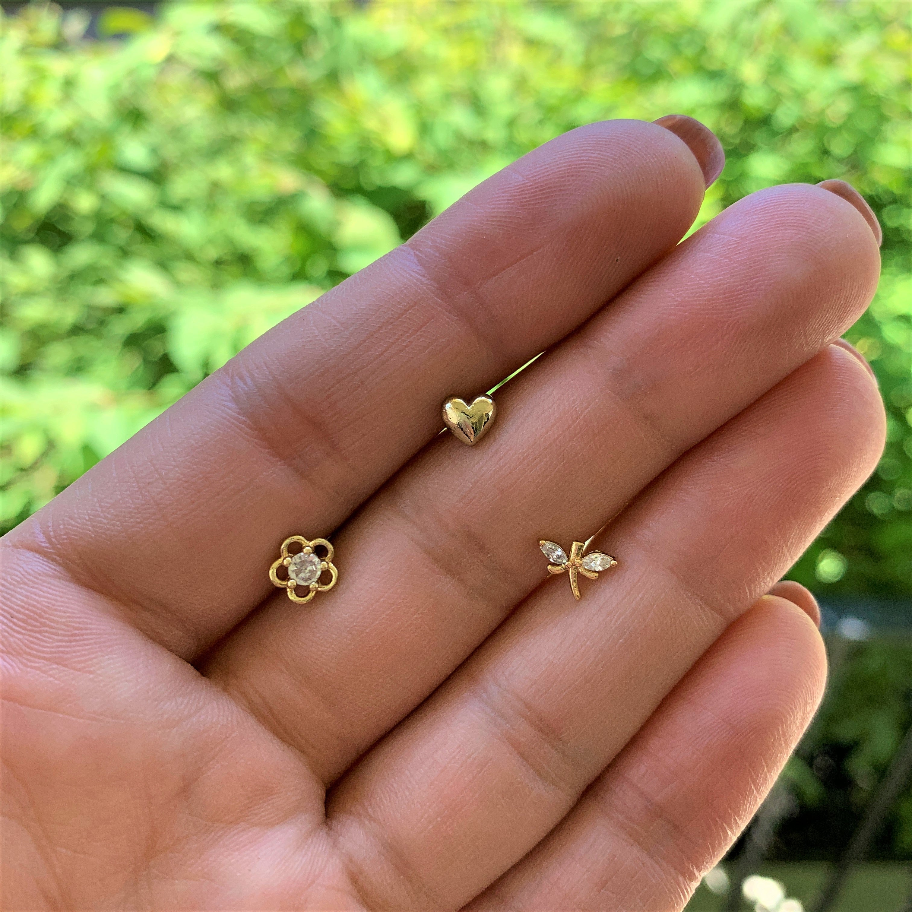 BodyCandy 16G 5/16 Clear CZ Gem Gold Tone Heart Labret Tragus Set of 3 — lifestyle context