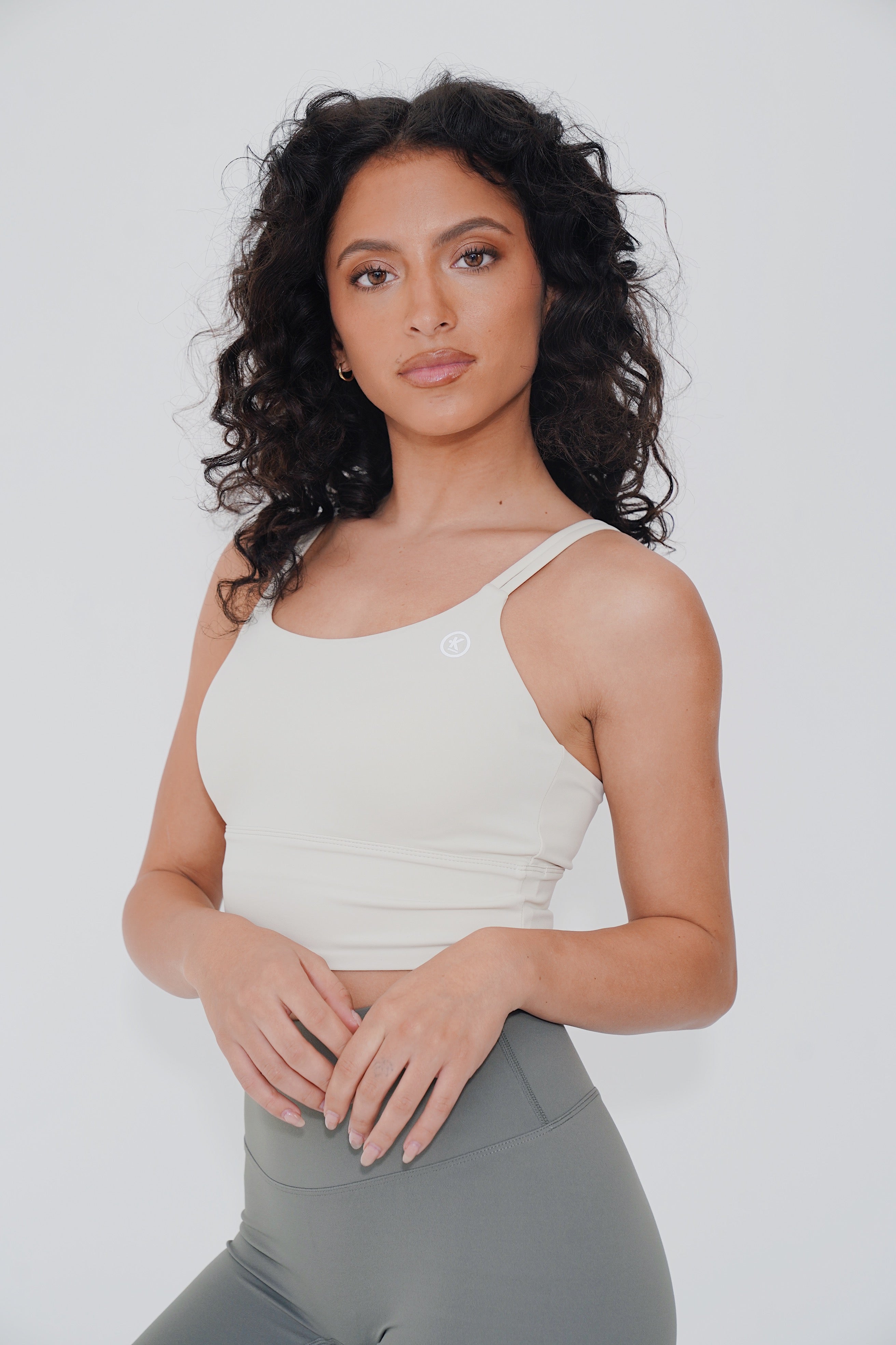 KIMITH BRAND I Am Confident White Cropped Tank — lifestyle worn / used context