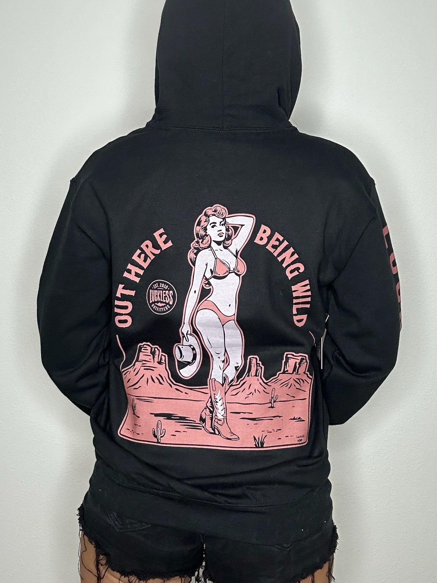Luckless Outfitters Out Here Being Wild Hoodie in Dusty Coral — side view