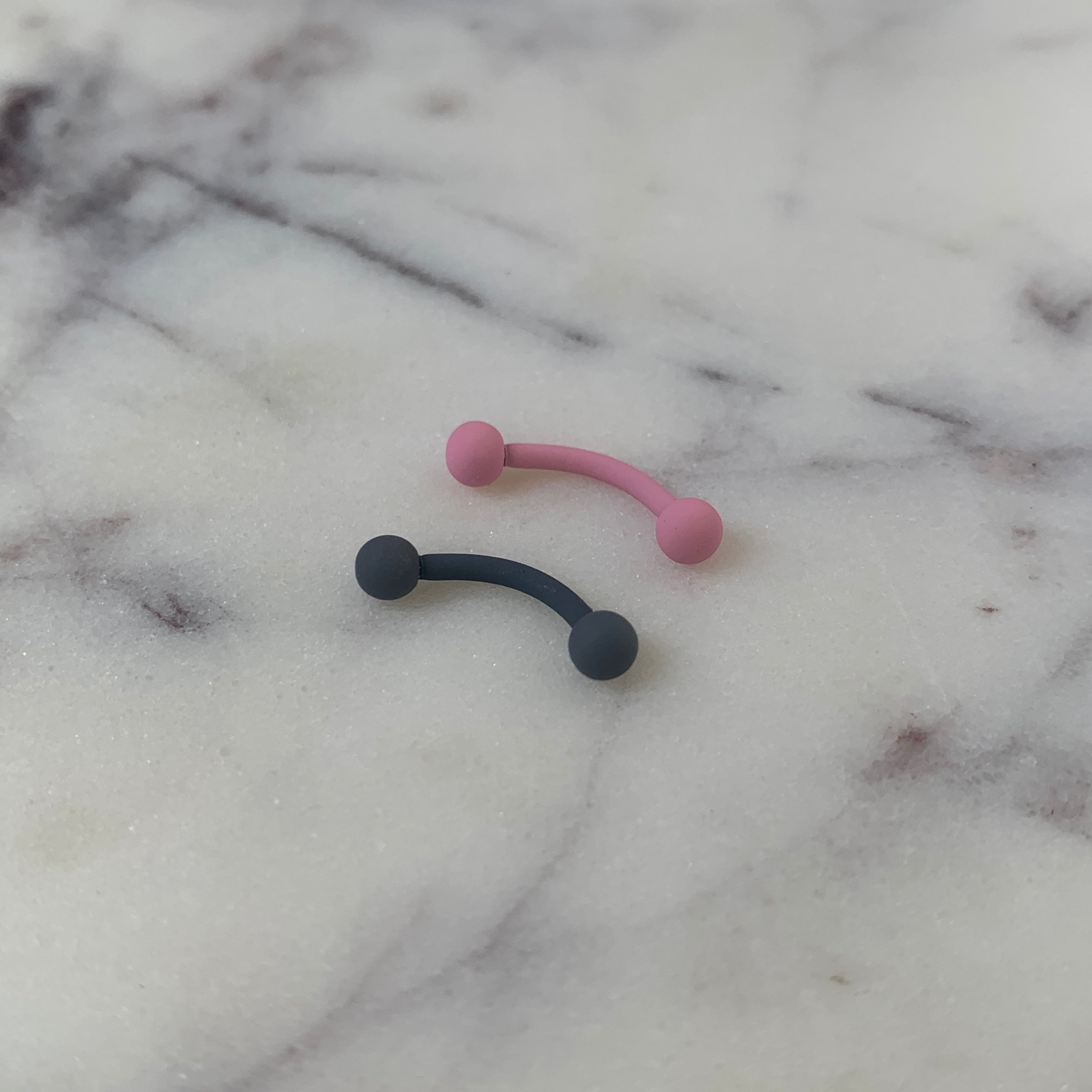 BodyCandy 16G 5/16 Pink Acrylic Matte Curved Eyebrow Ring — detail close-up