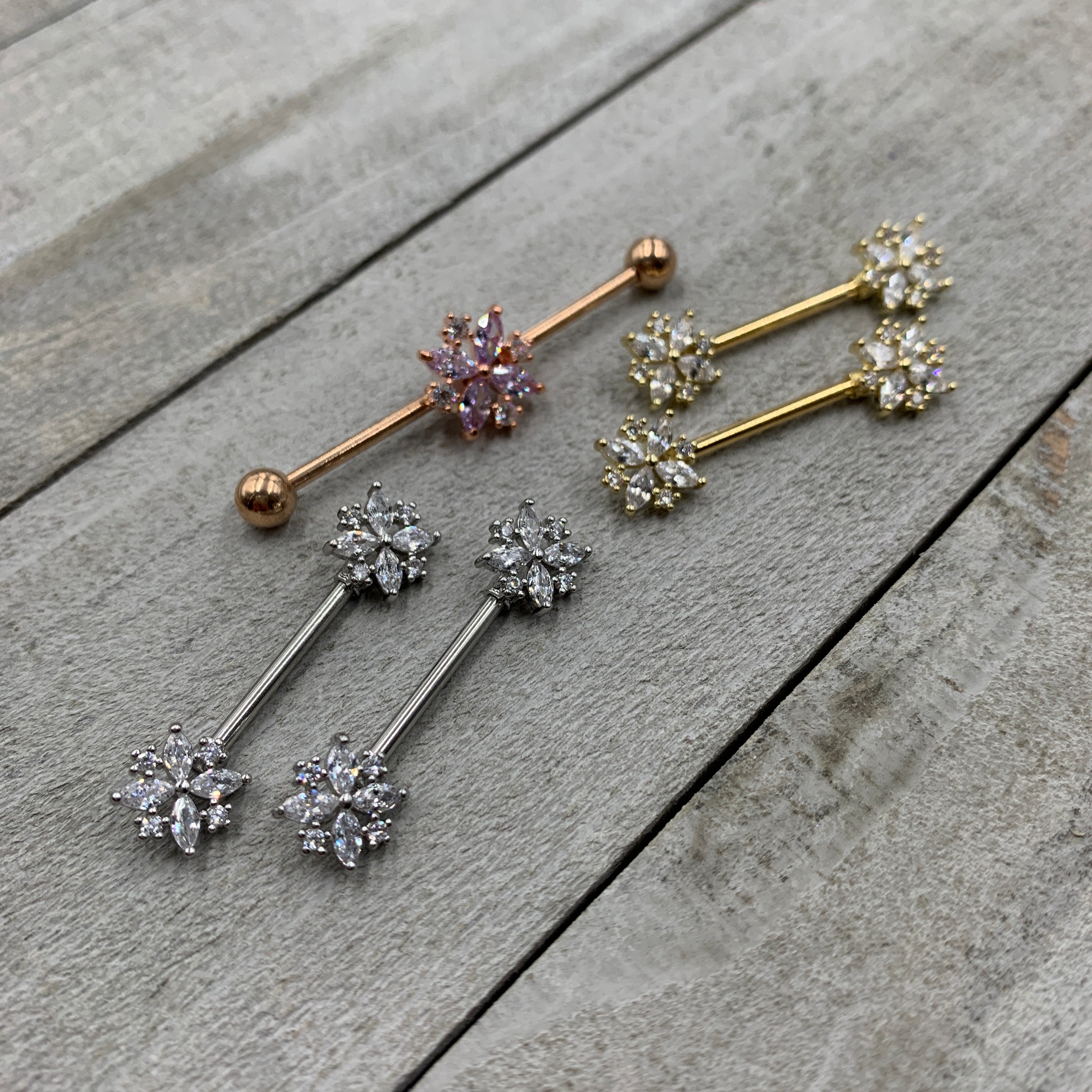 BodyCandy 14G Clear CZ Gem Rose Gold Tone Star Burst Industrial Barbell 38mm — lifestyle context
