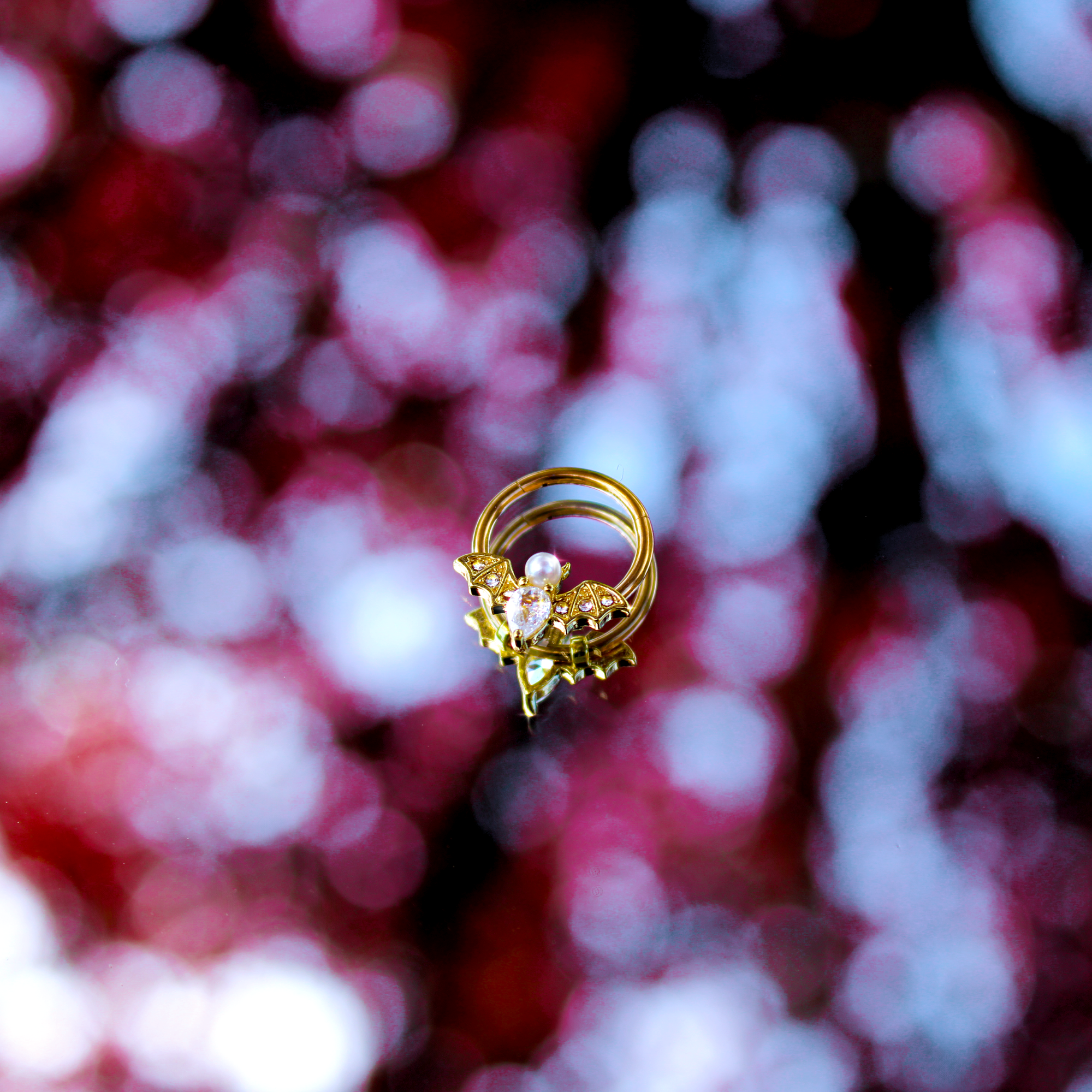 BodyCandy 16G 3/8 Clear Gem Gold Tone Bat Halloween Hinged Segment Ring — side view