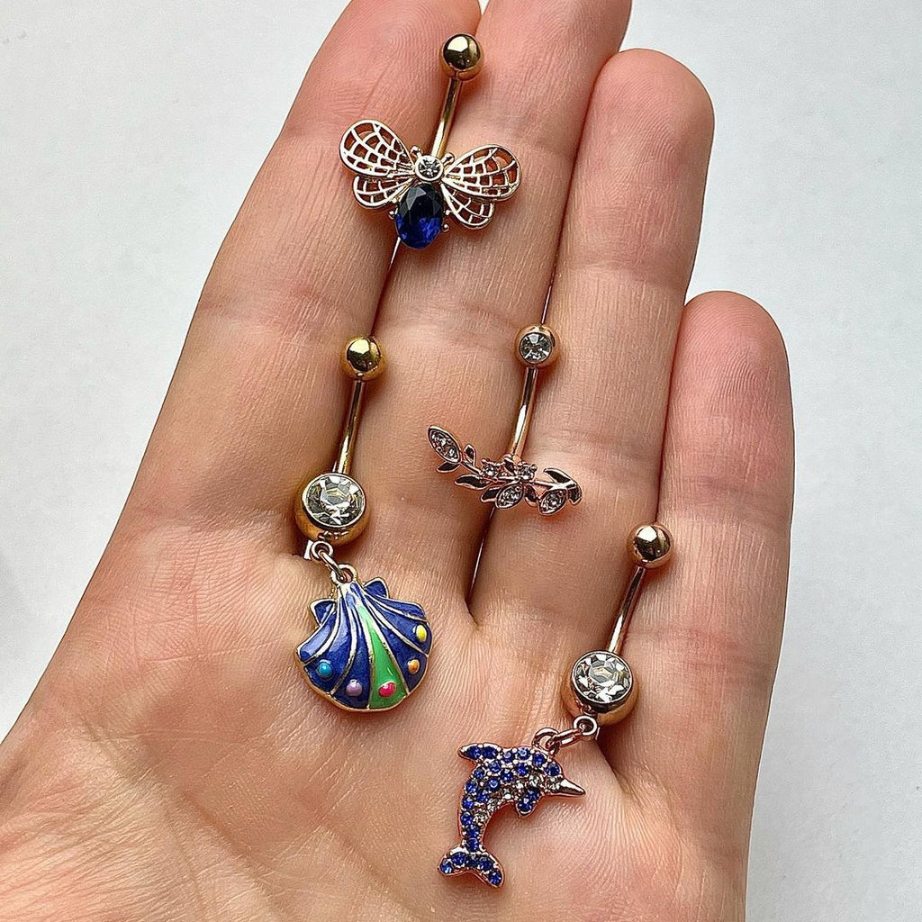 BodyCandy Clear Blue Gem Rose Gold Tone Dolphin Dangle Belly Ring — detail close-up