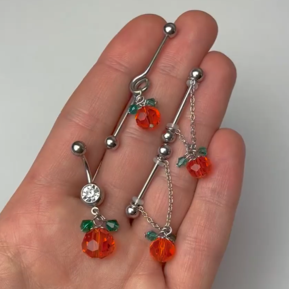BodyCandy Clear Green Orange Gem Pumpkin Halloween Dangle Belly Ring — detail close-up