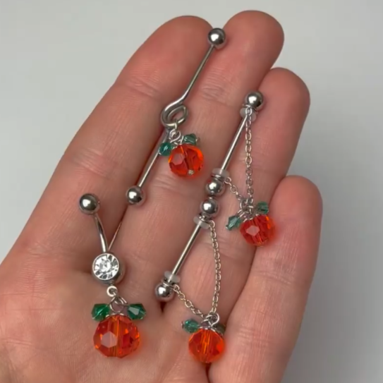 BodyCandy 14G Green Orange Gem Pumpkin Halloween Dangle Project Bar 38mm — detail close-up