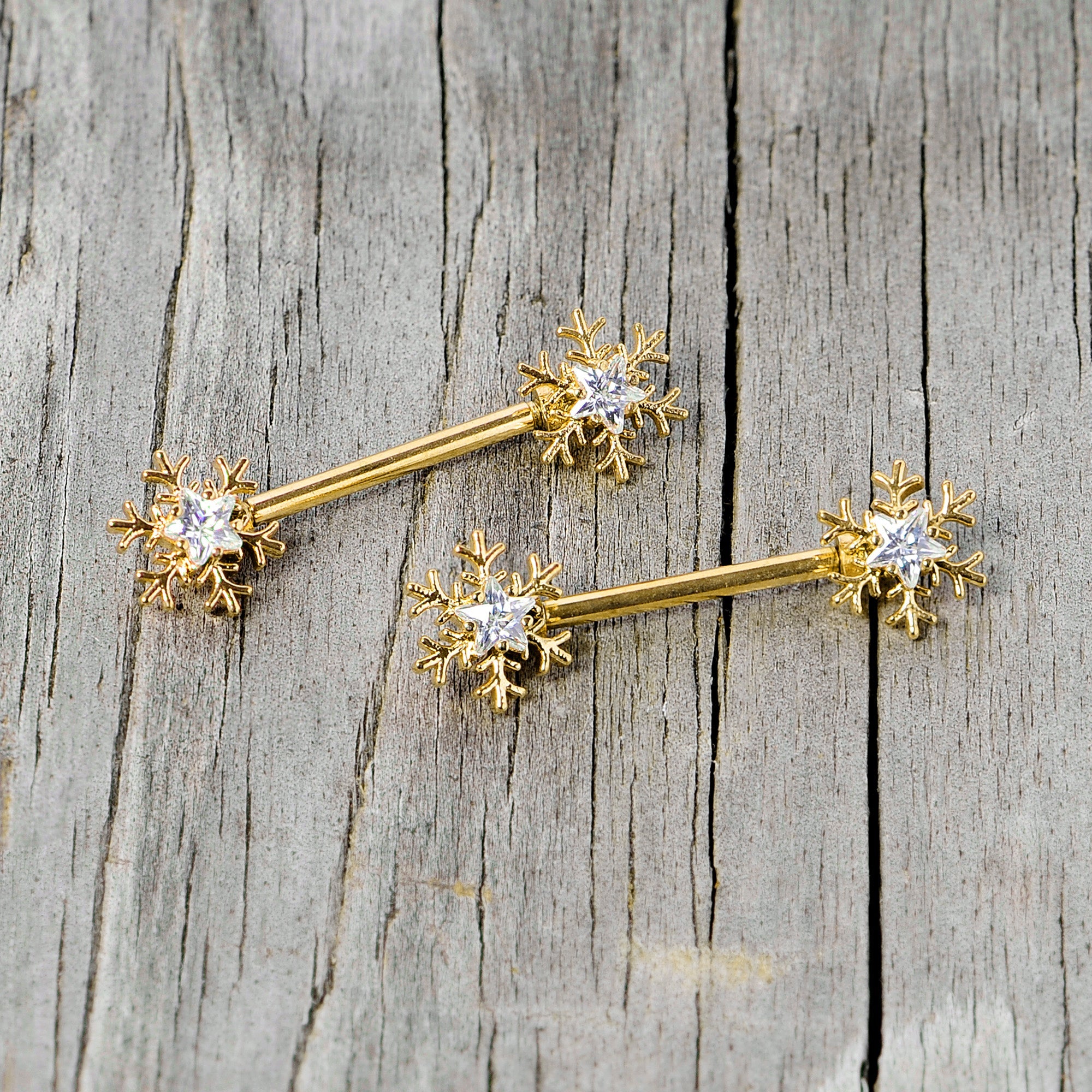 BodyCandy 14G 9/16 Clear Gem Gold Tone Snowflake Christmas Nipple Ring Set — lifestyle context
