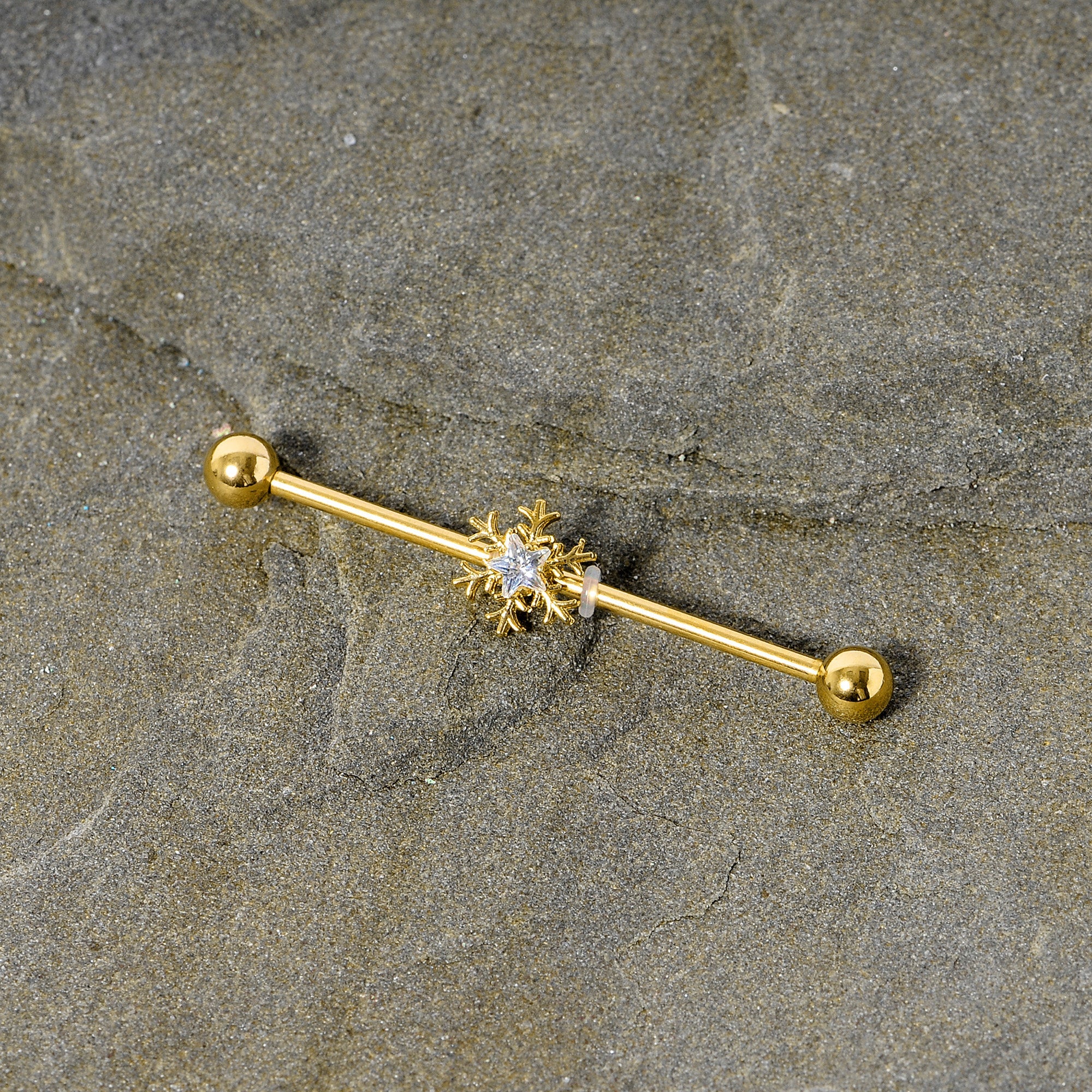 BodyCandy 14G Clear Gem Gold Hue Snowflake Christmas Industrial Barbell 38mm — detail close-up
