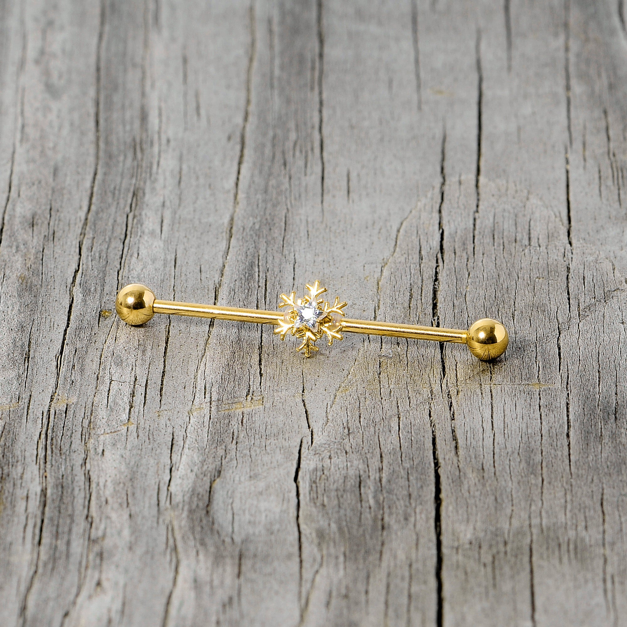 BodyCandy 14G Clear Gem Gold Hue Snowflake Christmas Industrial Barbell 38mm — side view